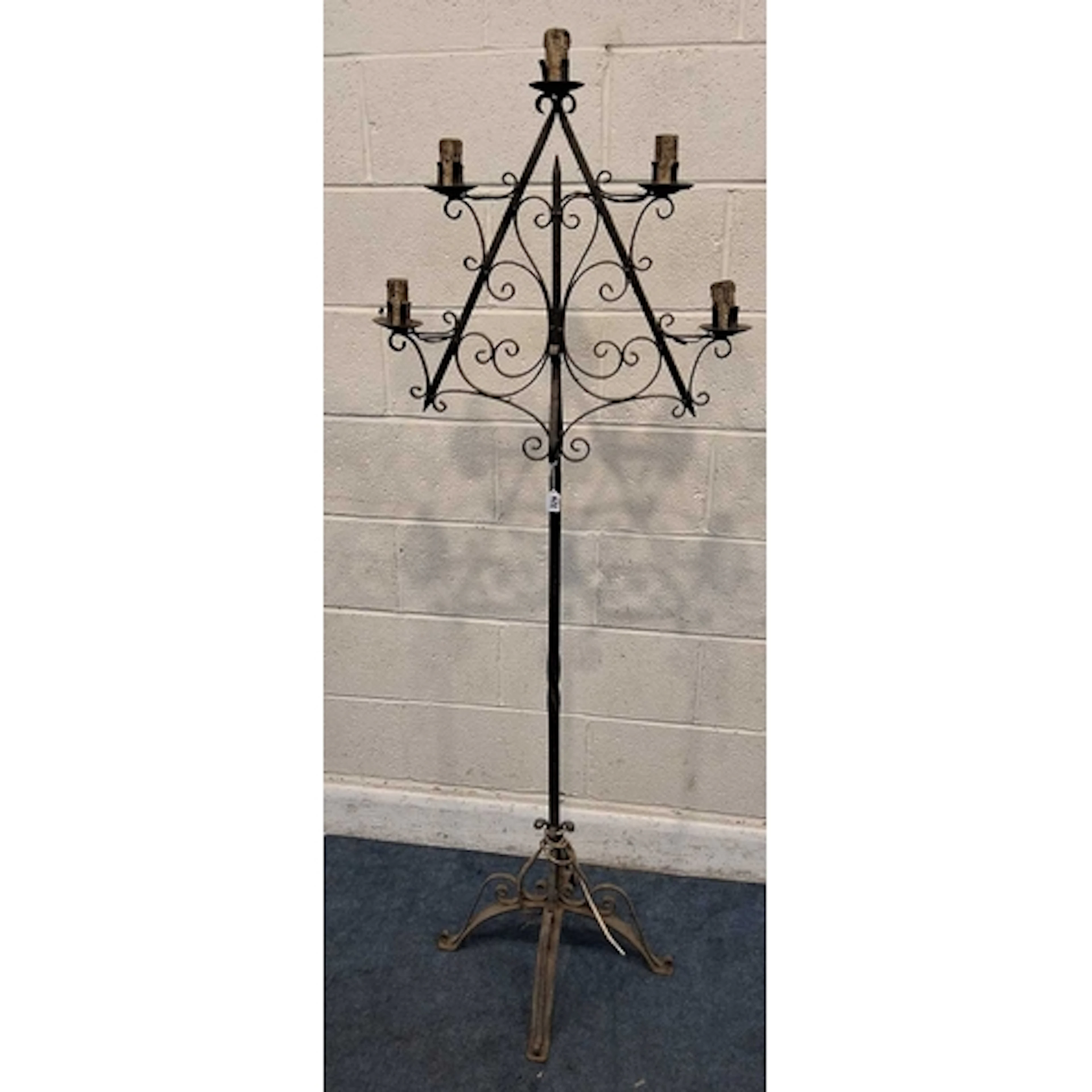 A WROUGHT IRON GOTHIC STYLE CANDELABRA, with five branches, ...