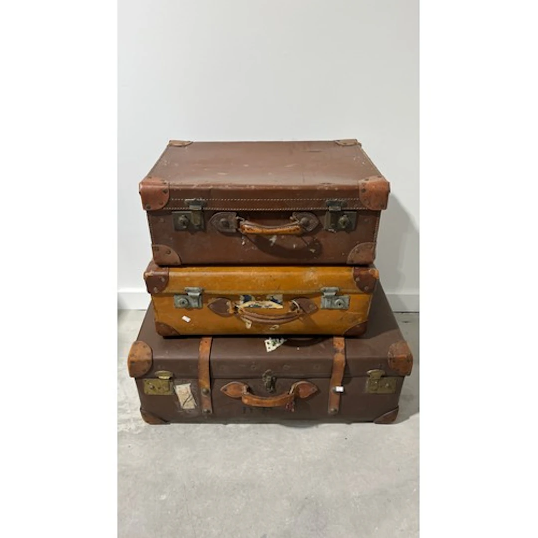 Three leather vintage suitcases.