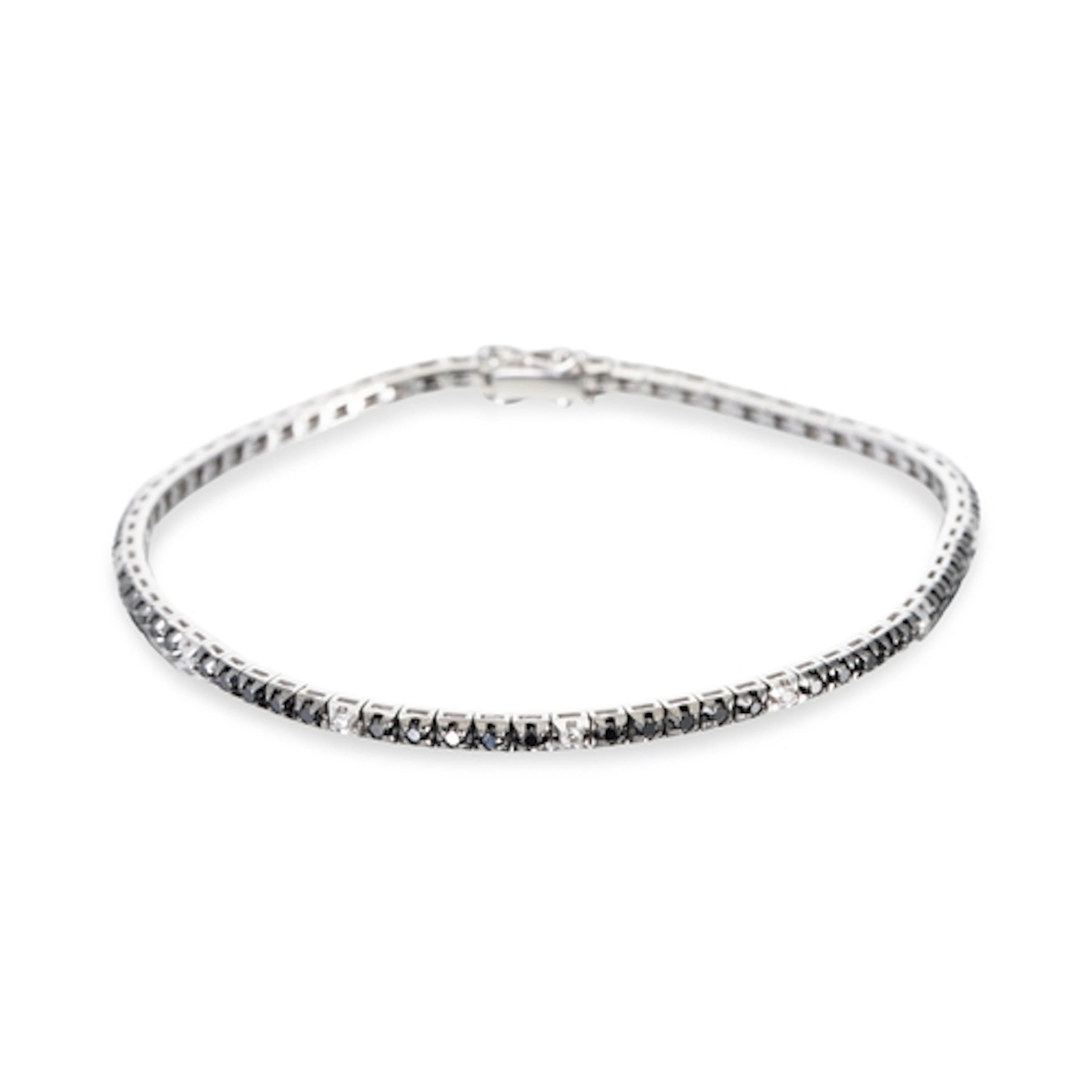 A BLACK & WHITE DIAMOND LINE BRACELET, the round cut black d...
