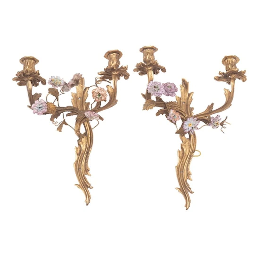 A set of four gilt bronze and porcelain adorned twin-light w...