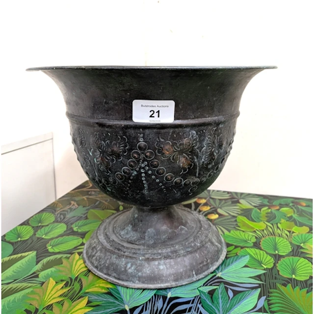 A Victorian style embossed copper jardiniere or wine cooler,...