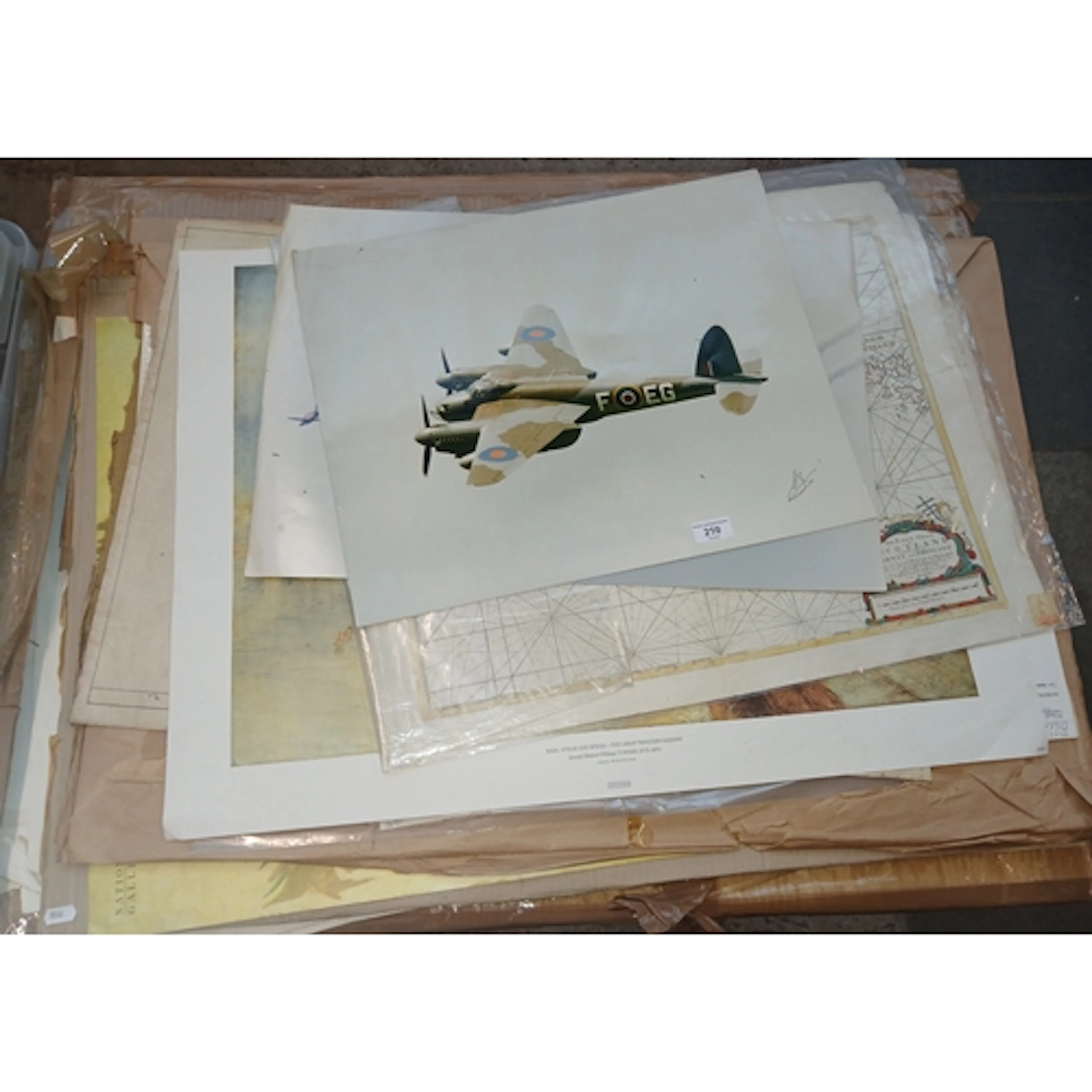A large collection of unframed prints of art works and maps,...