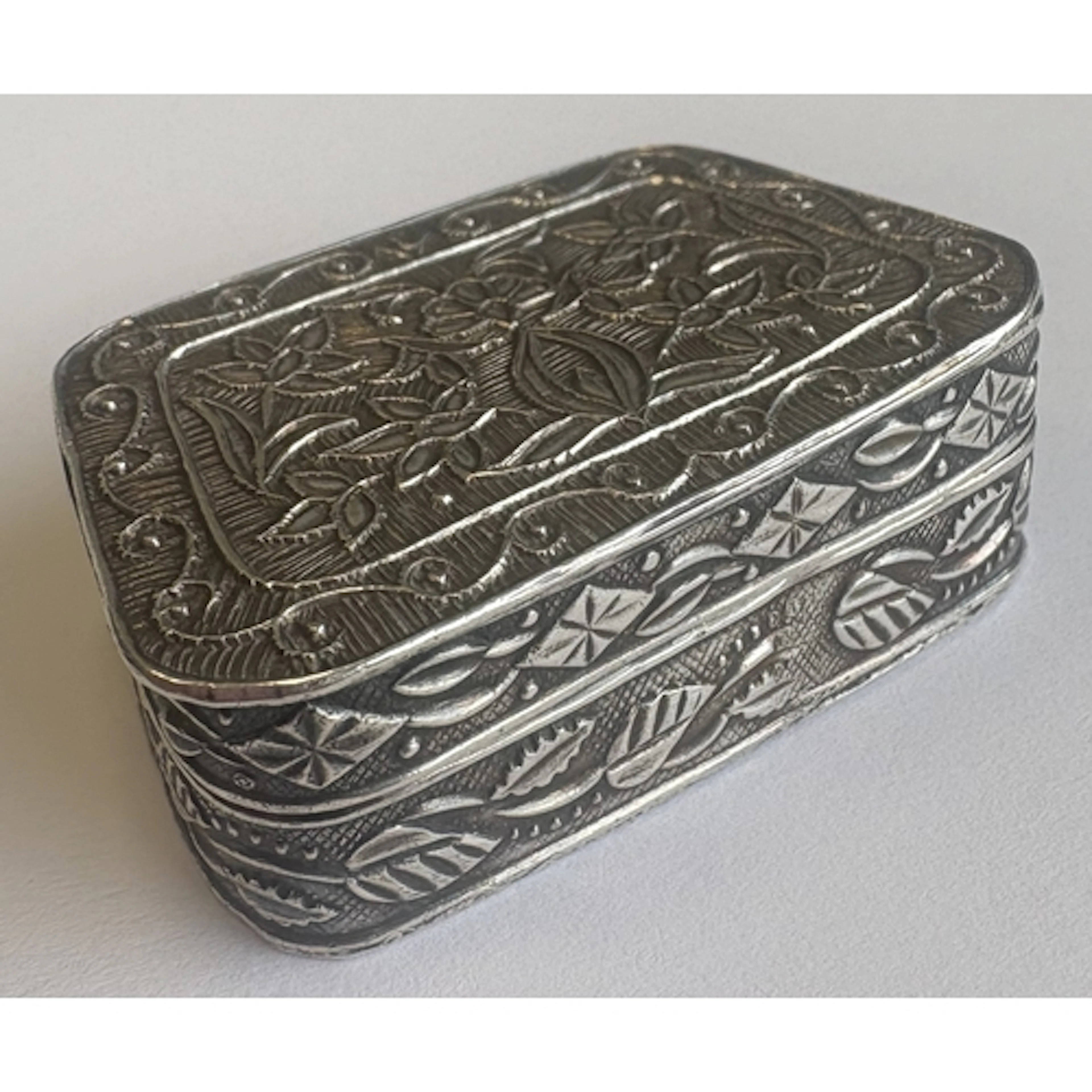 A good quality Continental silver pill box of tapering form ...