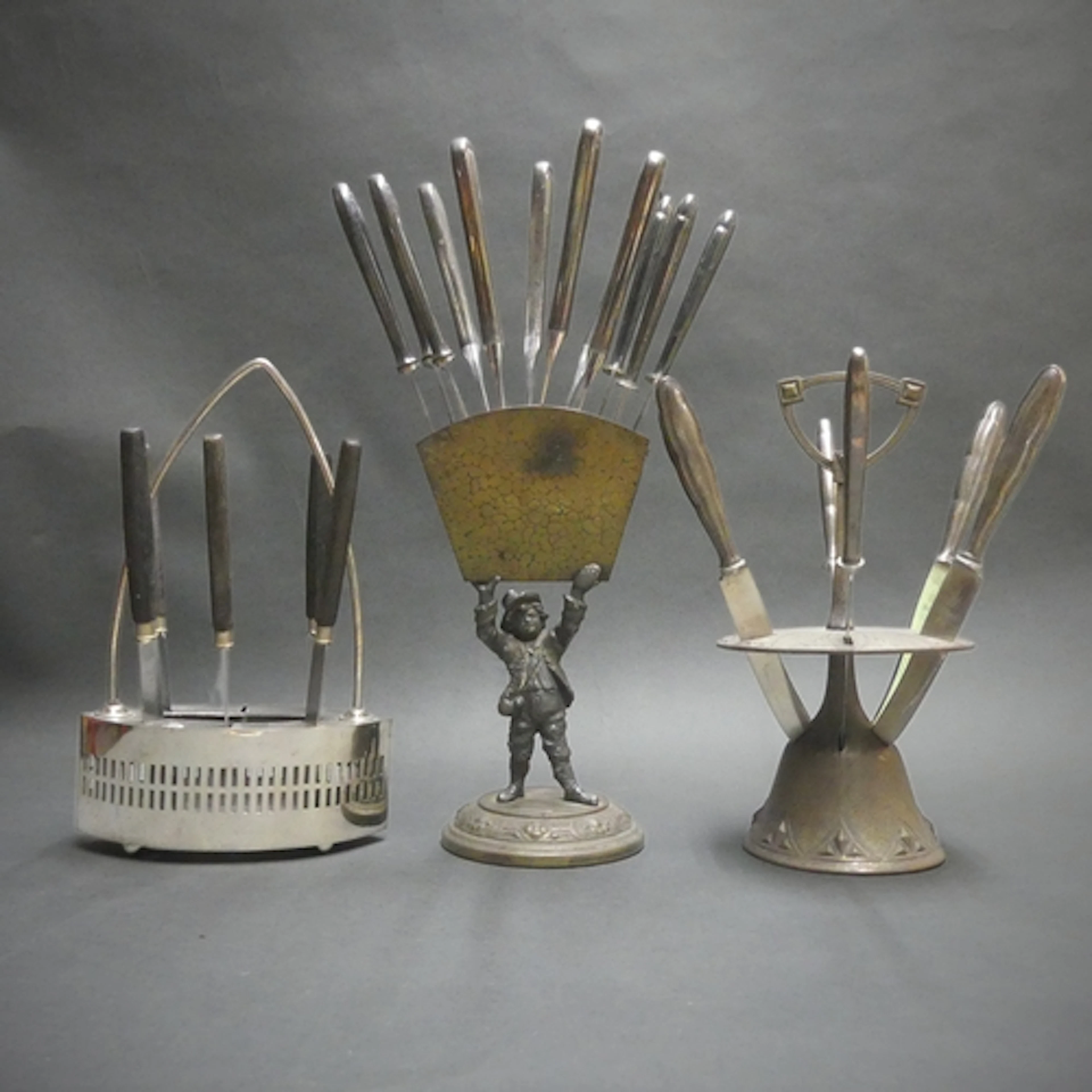 Three apparently unmarked Art Nouveau and later knife stands...