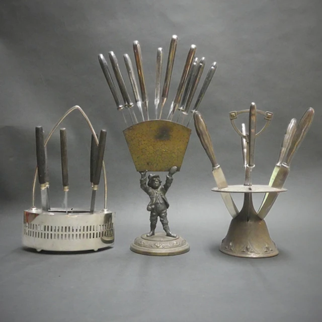 Three apparently unmarked Art Nouveau and later knife stands...