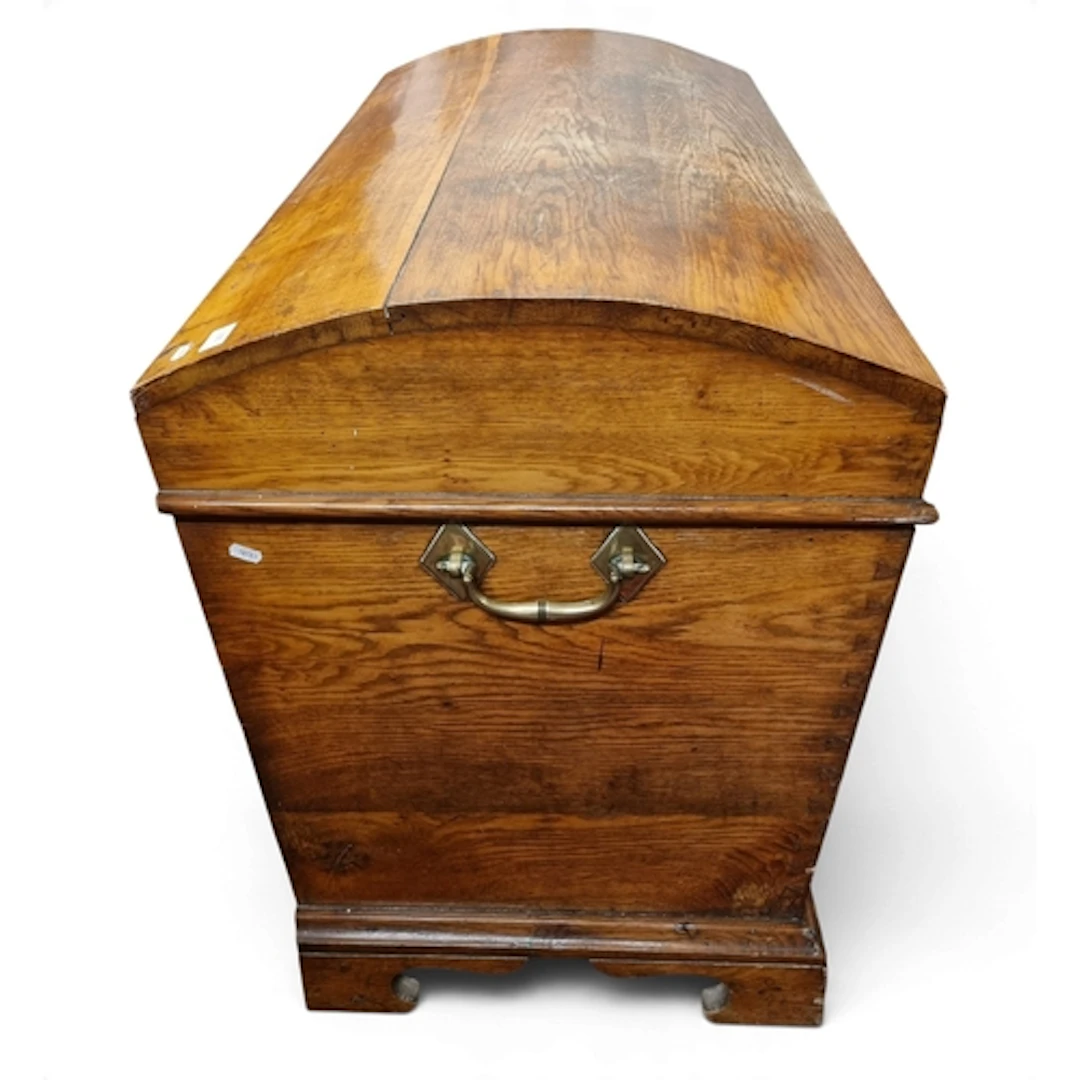 A 19th Century Oak domed Chest with large brass lifting hand...