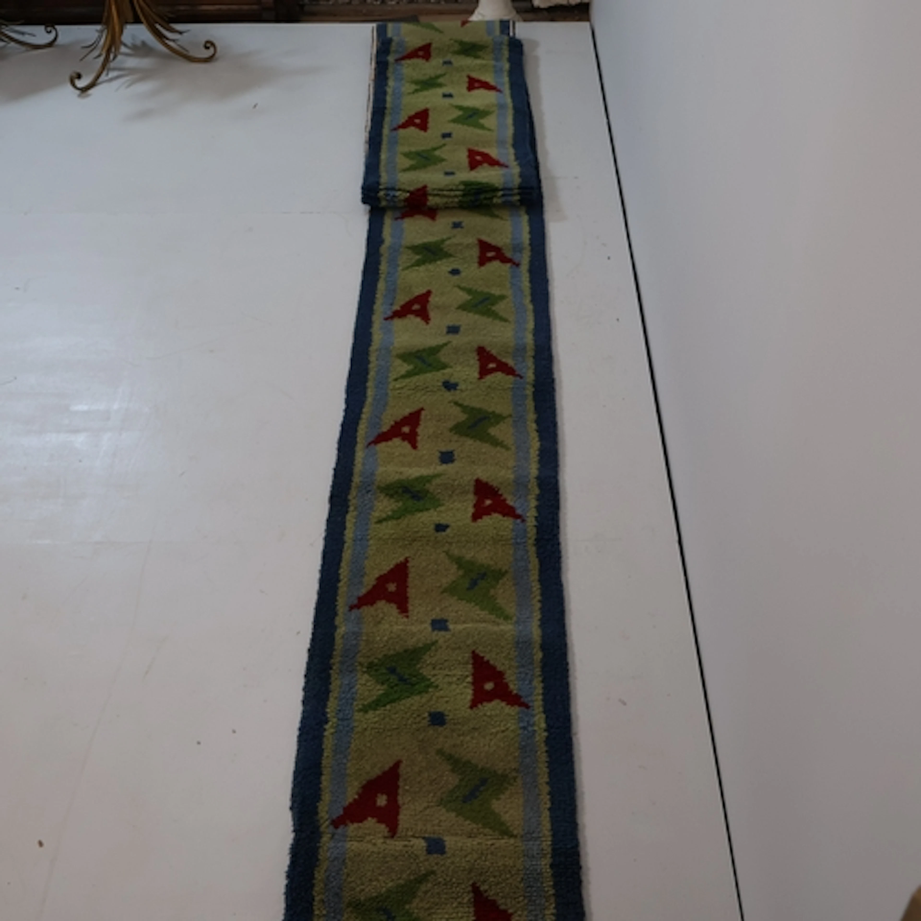 A Mid Century hand tufted carpet runner with abstract arrowh...