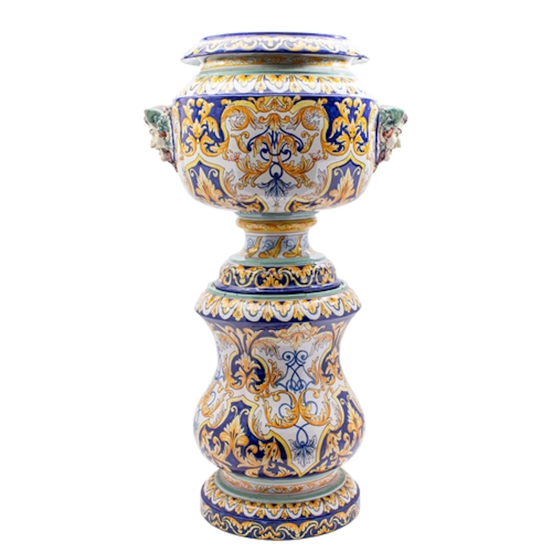An Antoine Montagon [Nevers] faience jardiniere and stand, t...