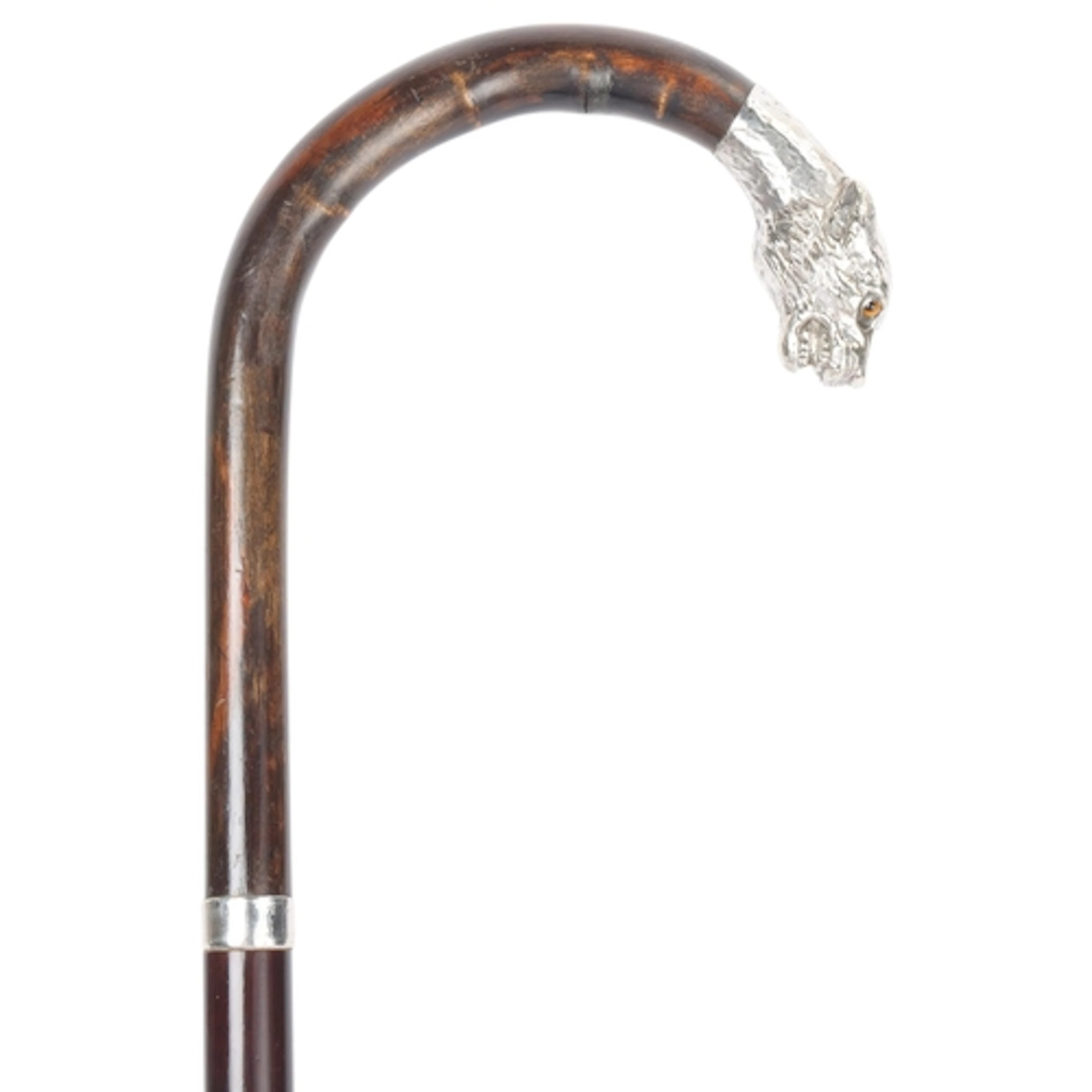 An antique crook-handled cane with a silver animal head term...