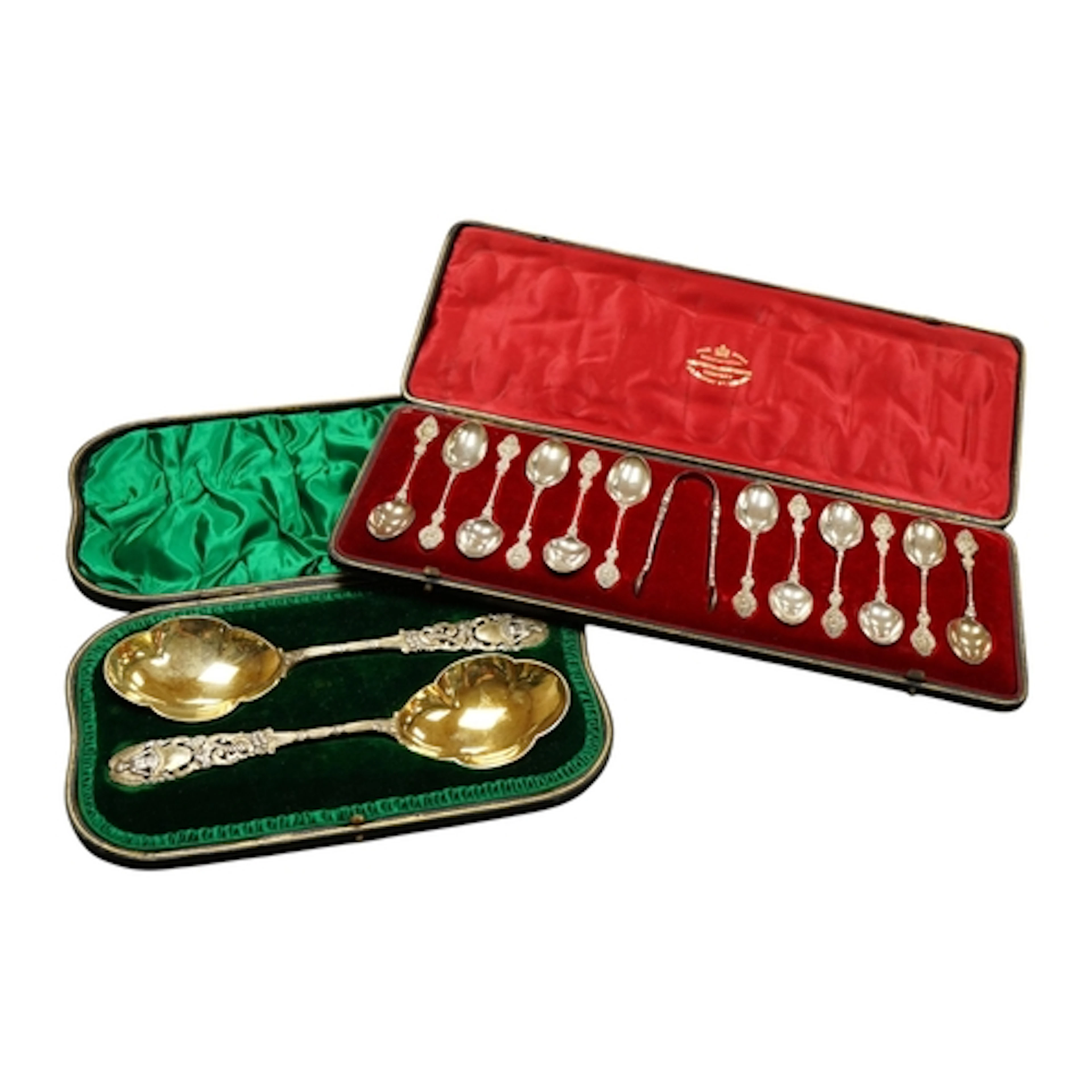 An Edwardian case pair of ornate parcel gilt silver serving ...