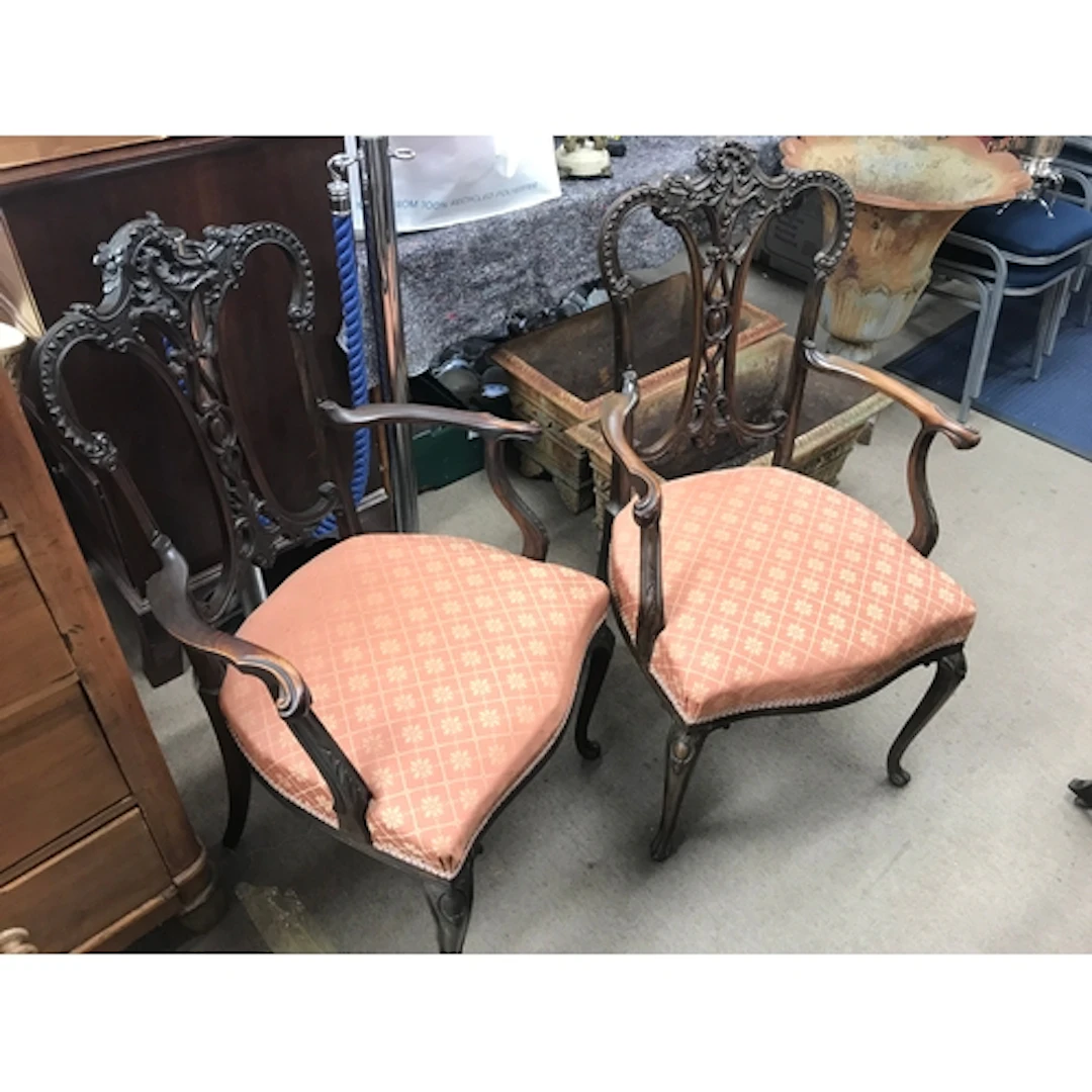 Two 19th century mahogany armchairs featuring a intricate pi...