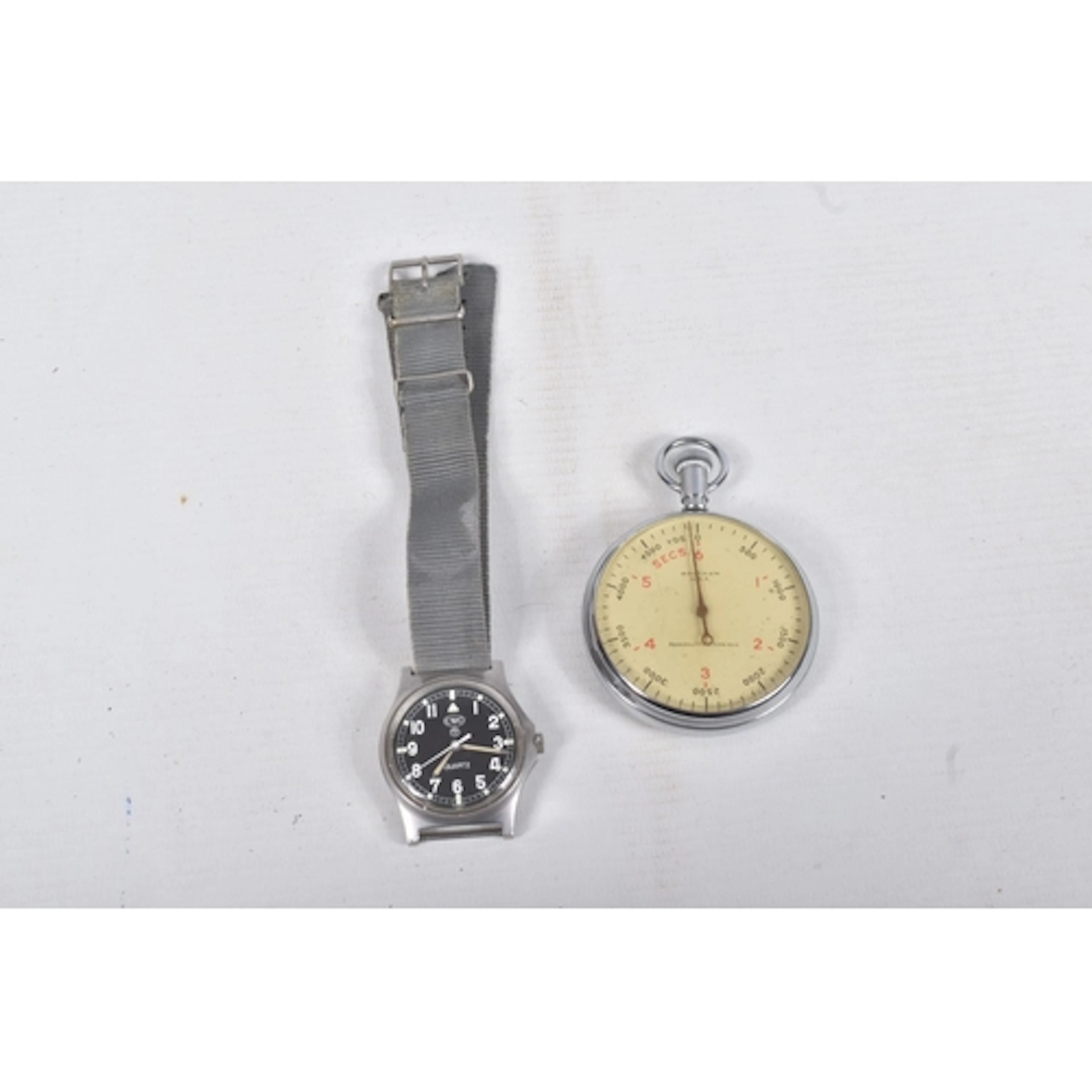 A CWC BRITISH MILITARY ISSUE WRISTWATCH AND A MILITARY STOP ...