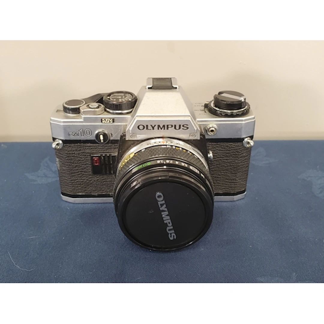 An Olympus OM-10 silver with 50mm f1.8 Zuiko