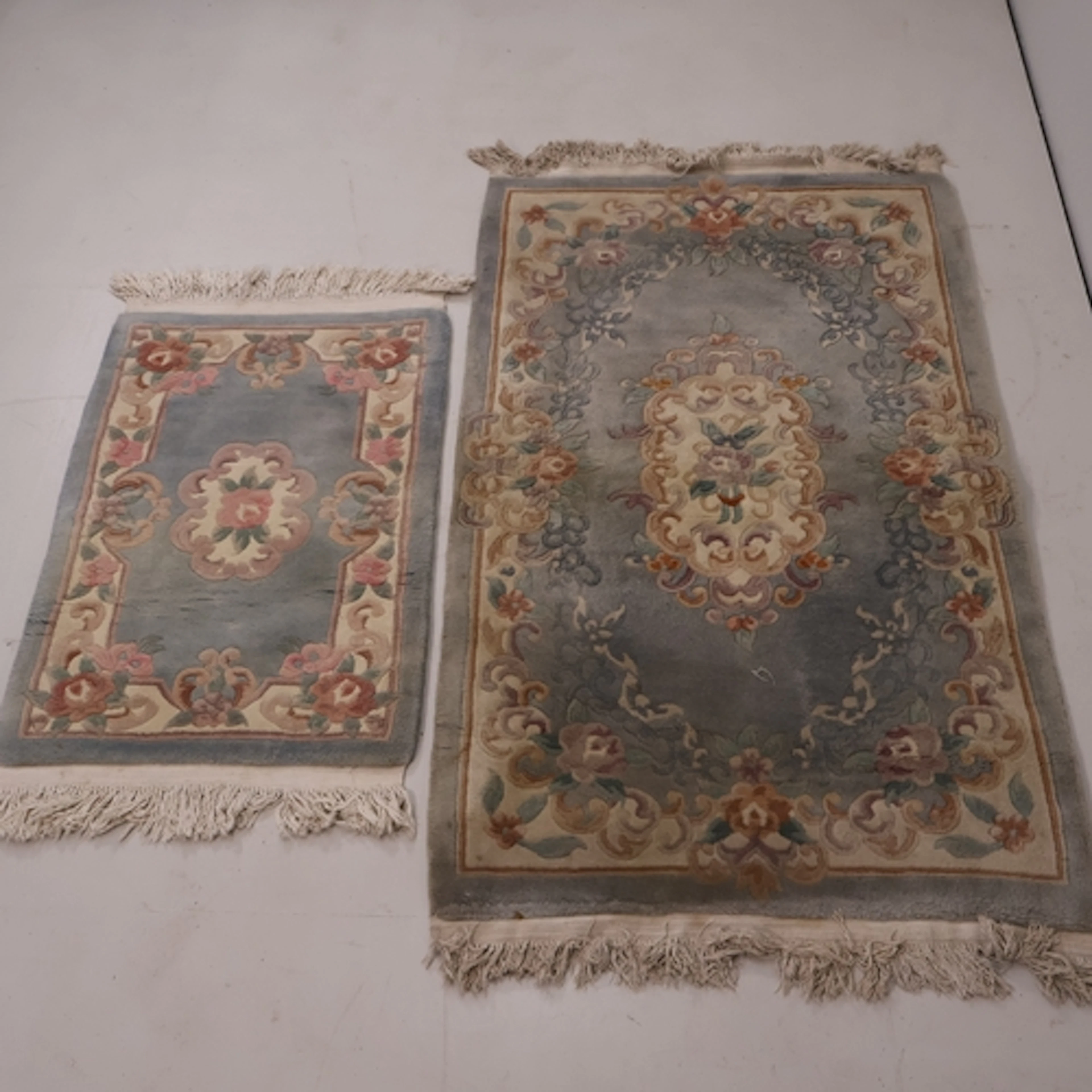 Two Chinese blue ground rugs, Largest L154cm, W93cm.