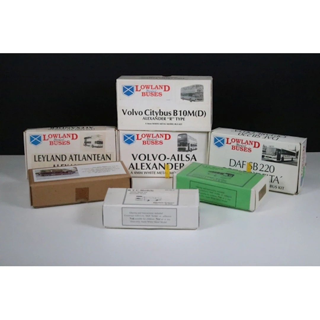 Seven boxed white metal model bus kits to include 4 x Lowlan...