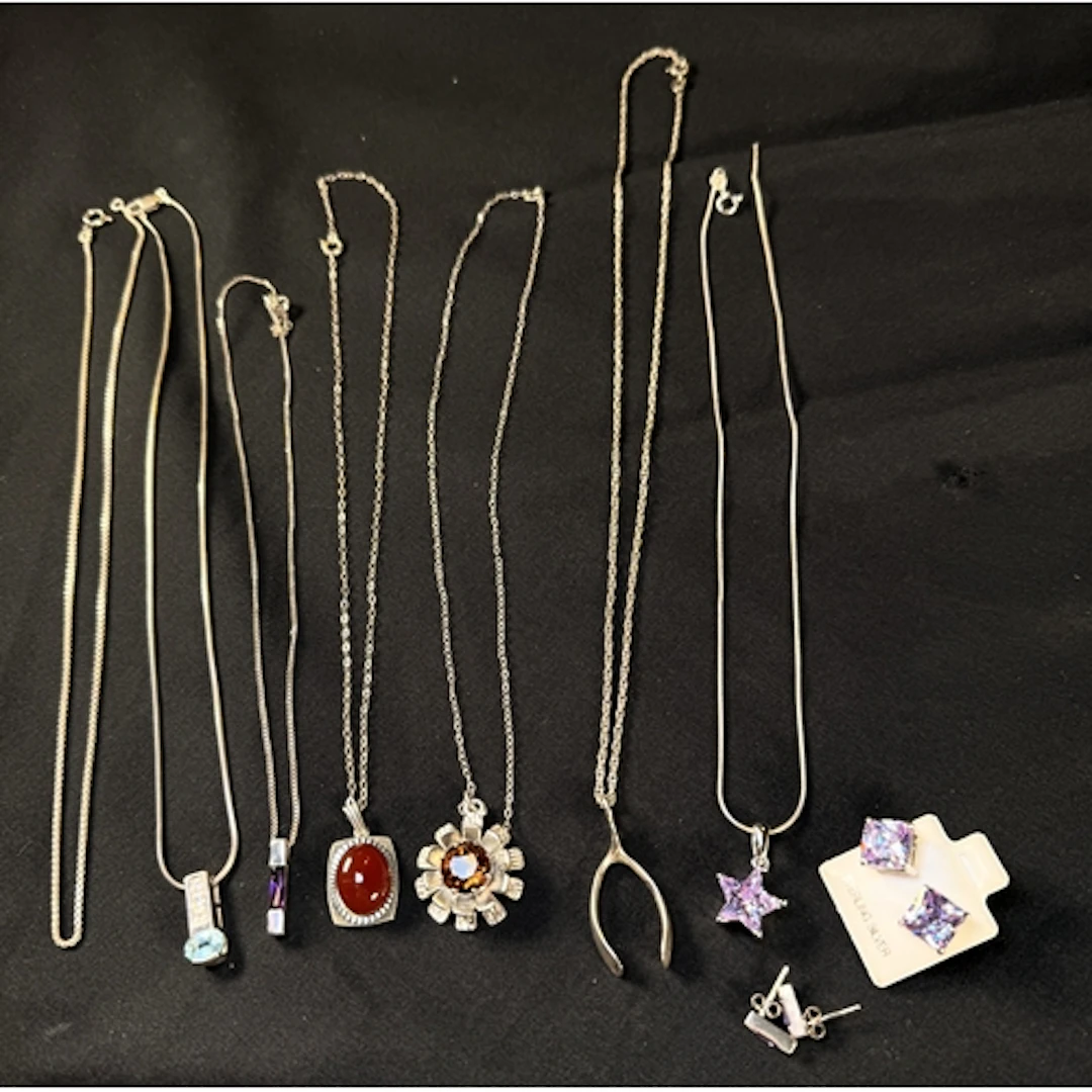 A selection of silver/white metal necklaces and earrings. 42...