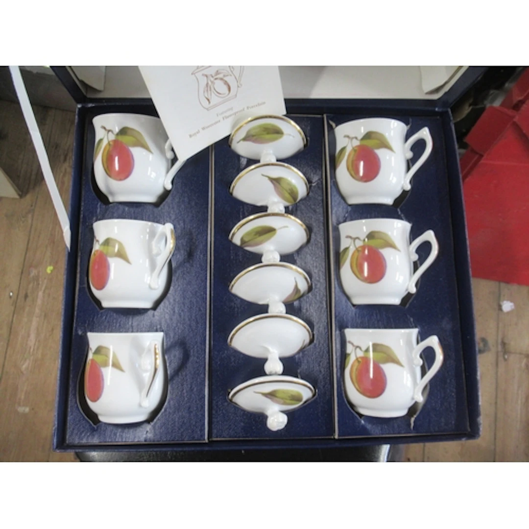 A boxed Royal Worcester set of six Evesham pattern chocolate...