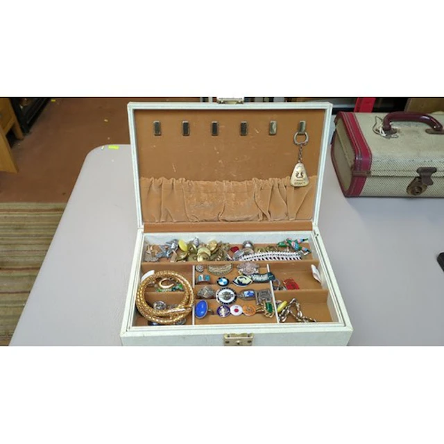 A quantity of costume jewellery and enamel motorcycle badges...