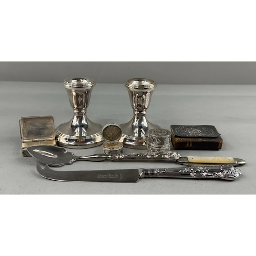 Silver: a pair of filled silver dwarf candlesticks, Birmingh...