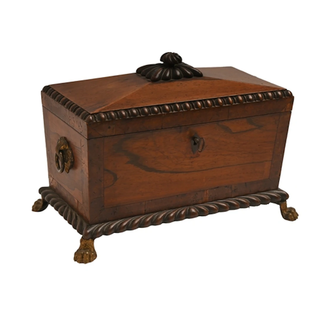 A George IV mahogany sarcophagus shaped tea chest, with burr...
