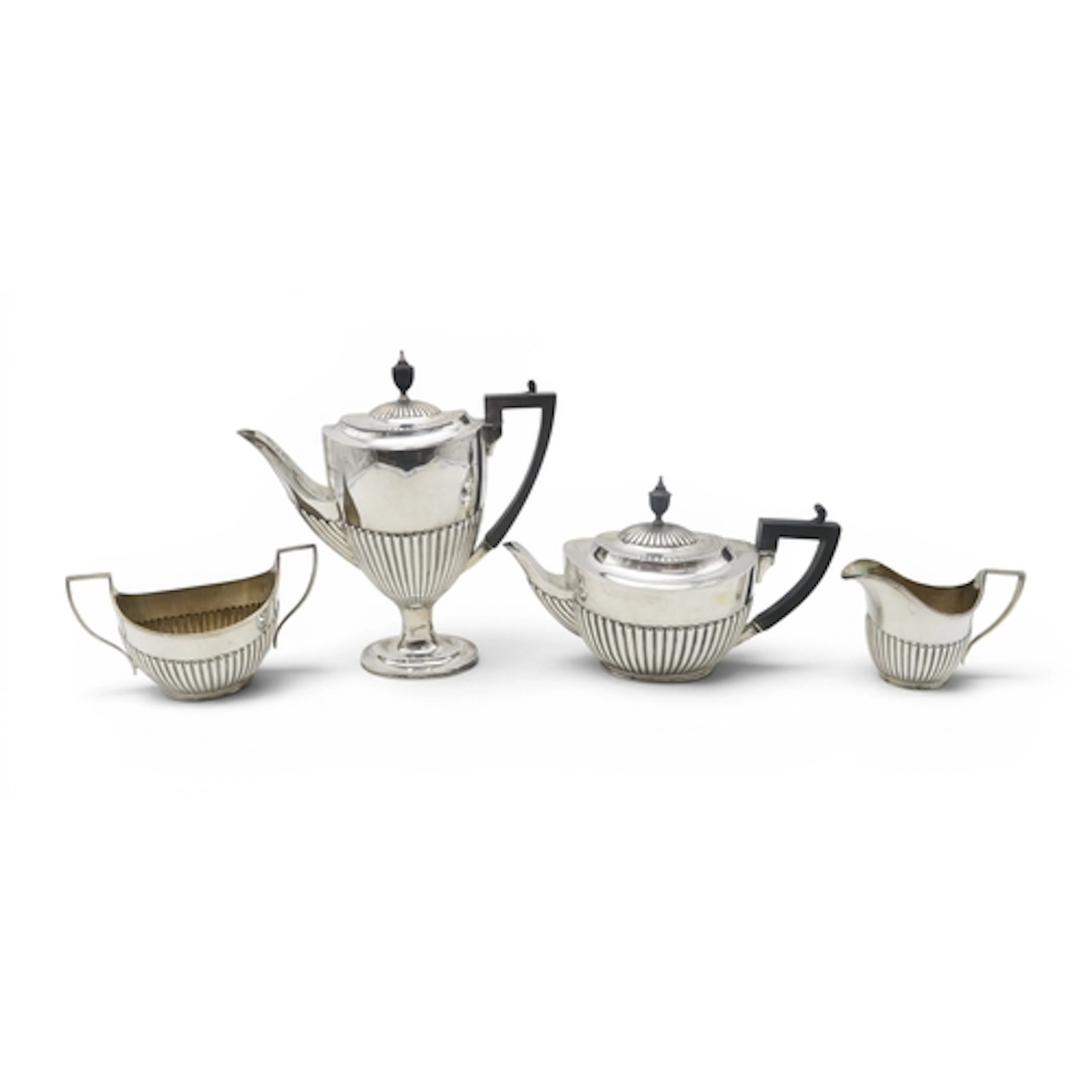 A MATCHED LATE VICTORIAN / EARLY EDWARDIAN FOUR PIECE SILVER...