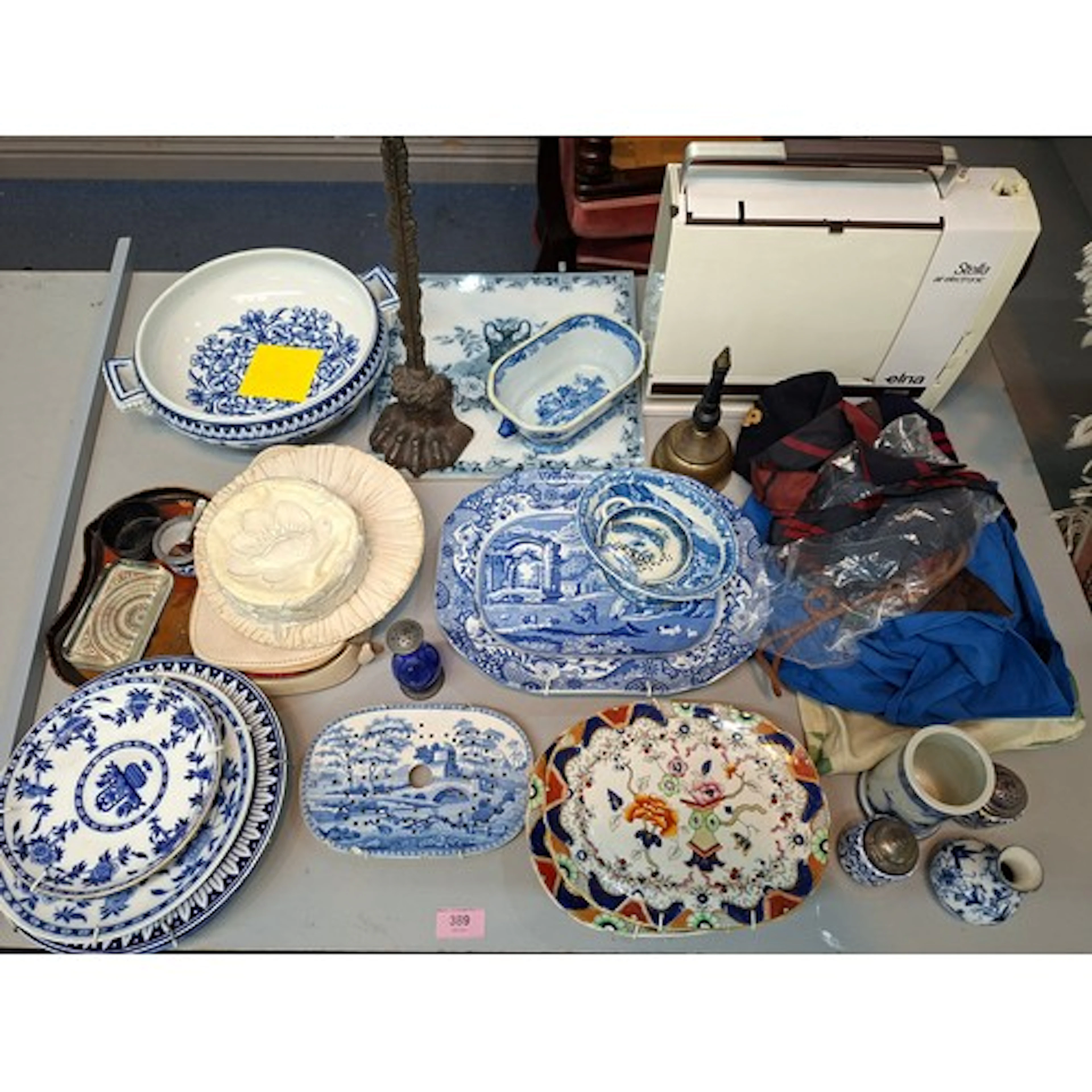 Mixed items to include blue and white ceramics, a brass bell...