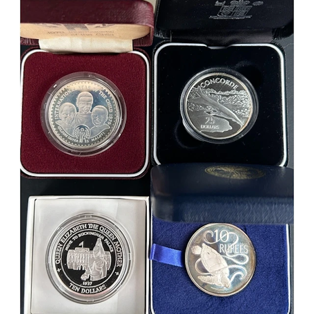 A group of five boxed silver coins, comprising New Zealand 1...