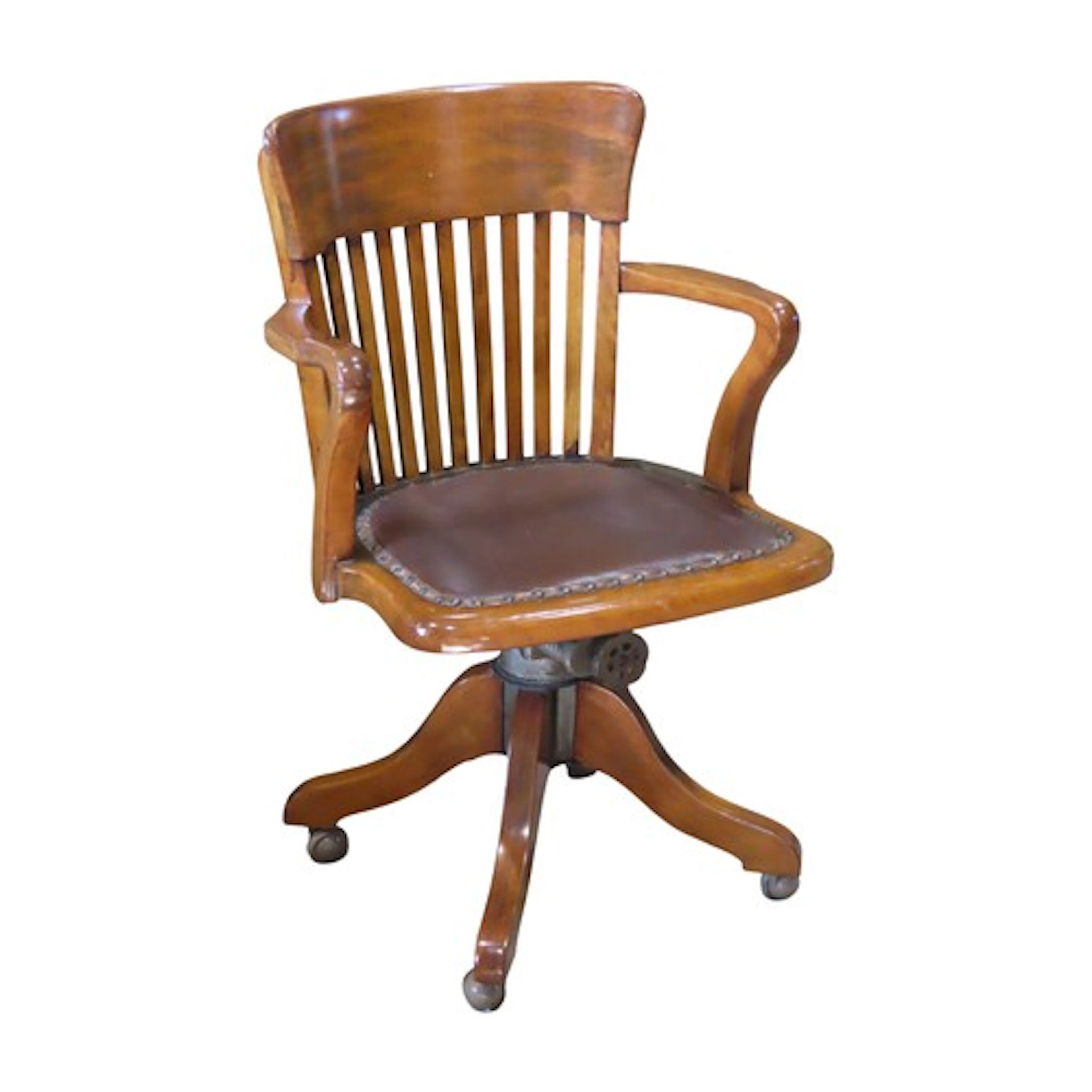 A vintage swivel and adjustable office desk chair with stain...