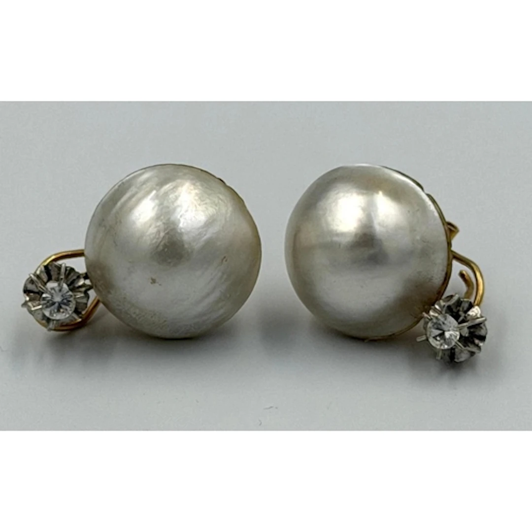 A pair of blister pearl and diamond earrings