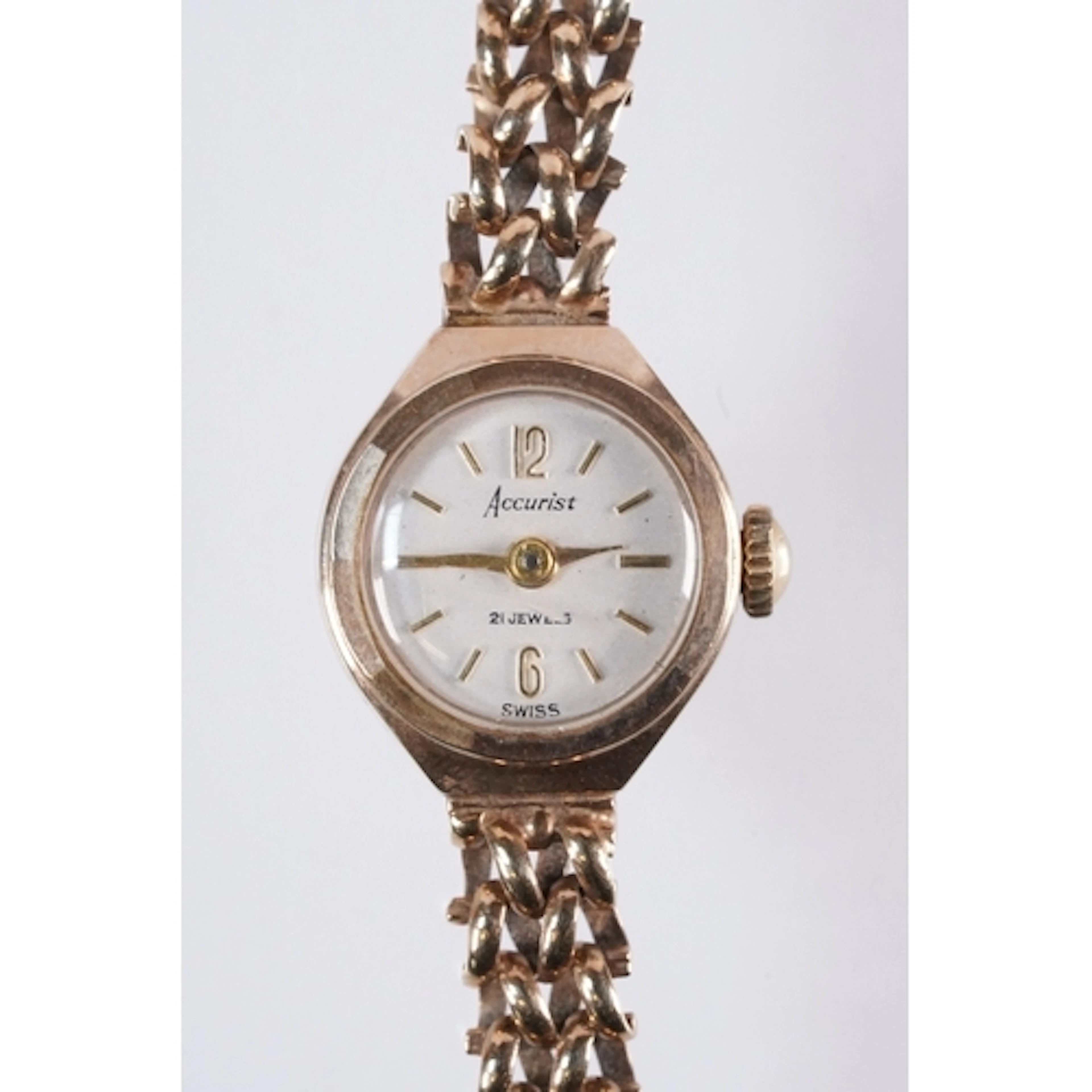 9ct gold Accurist wrist watch having a round face with baton...