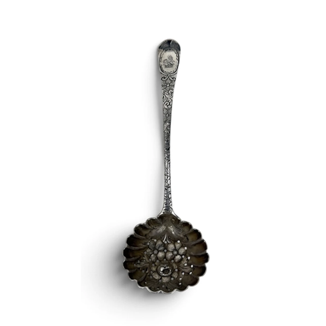 A GEORGE III SILVER SIFTER SPOON, LATER EMBOSSED IN 'BERRY' ...