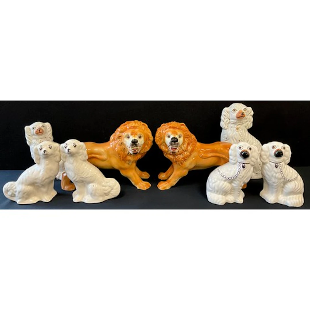 Staffordshire - a pair of Staffordshire lions, glass eyes, b...