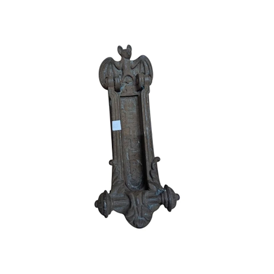 An early 20th century cast iron bat door knocker. Featuring ...