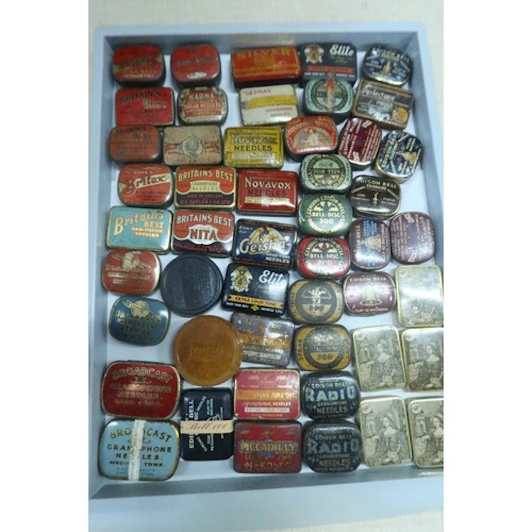 A tray of vintage gramphone needle tins