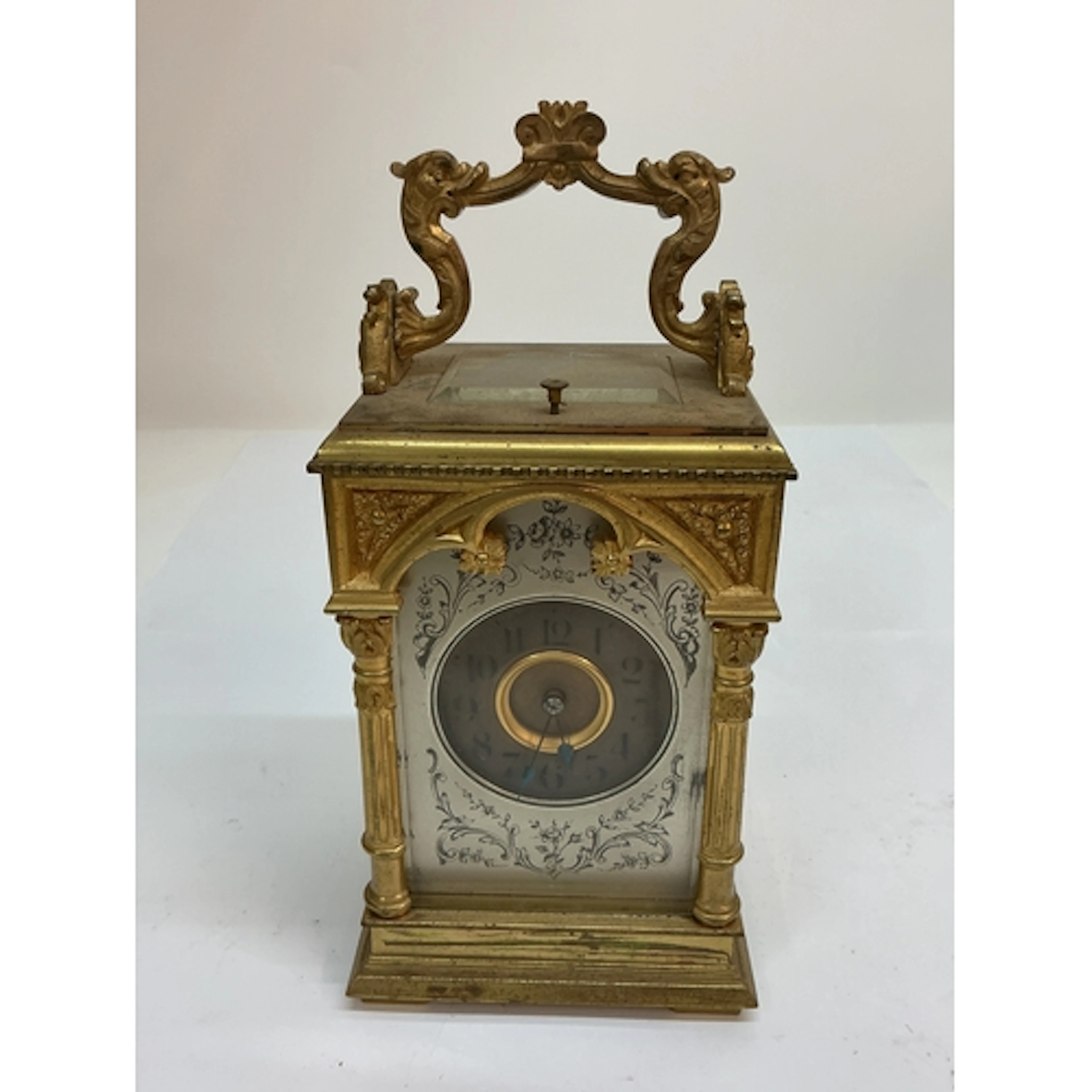 An elaborate strike repeat, gilt carriage clock with decorat...