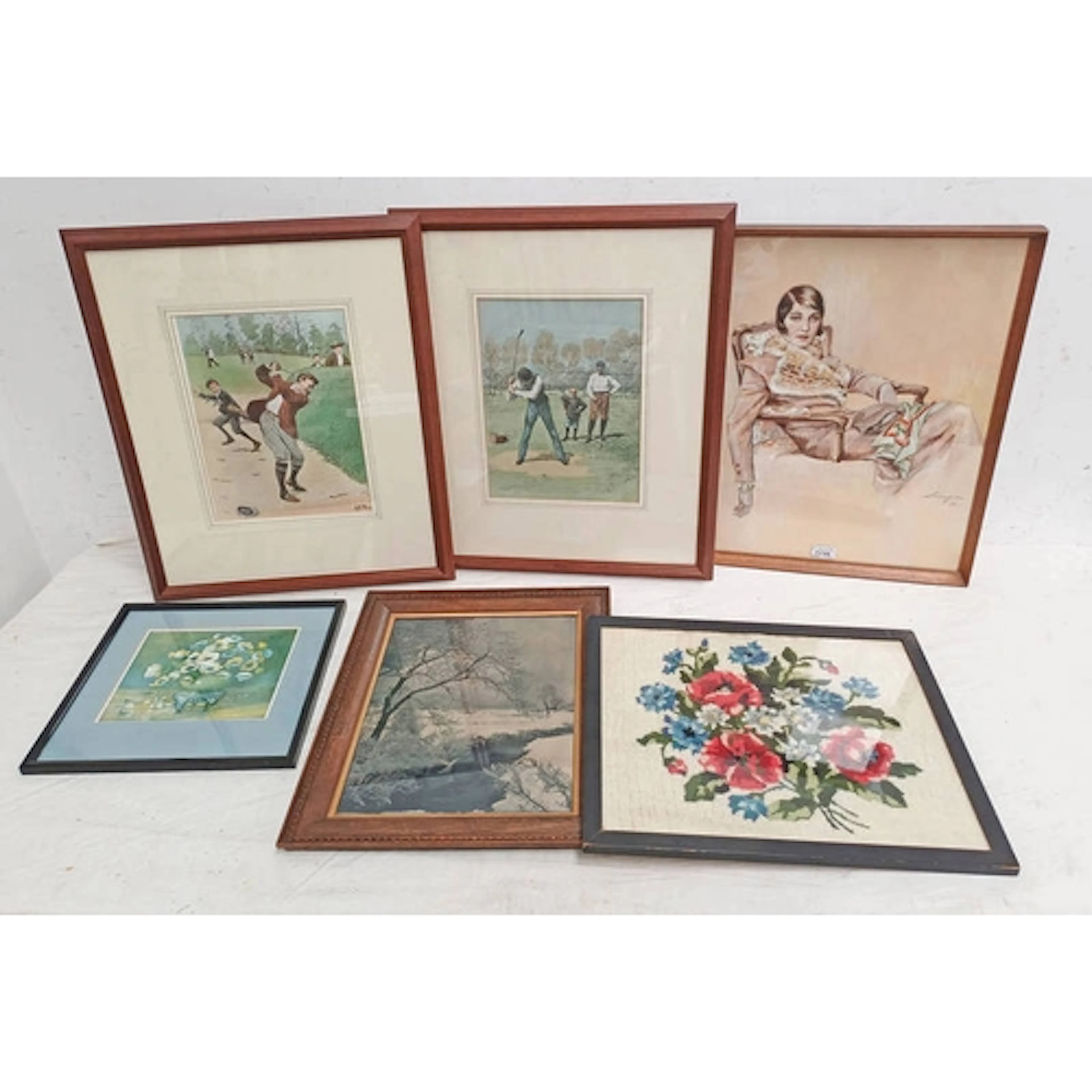 FRAMED WATERCOLOUR OF A WOMAN LOUNGING IN A CHAIR WITH FUR C...