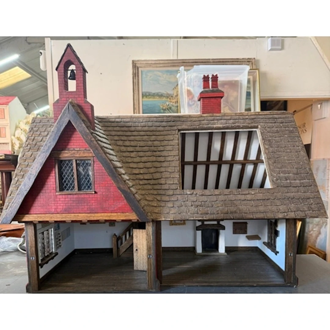 A scratch-built red brick style dollhouse together with a qu...