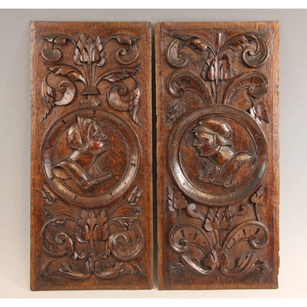 A pair of 16th century style carved oak bas-relief Romayne-t...