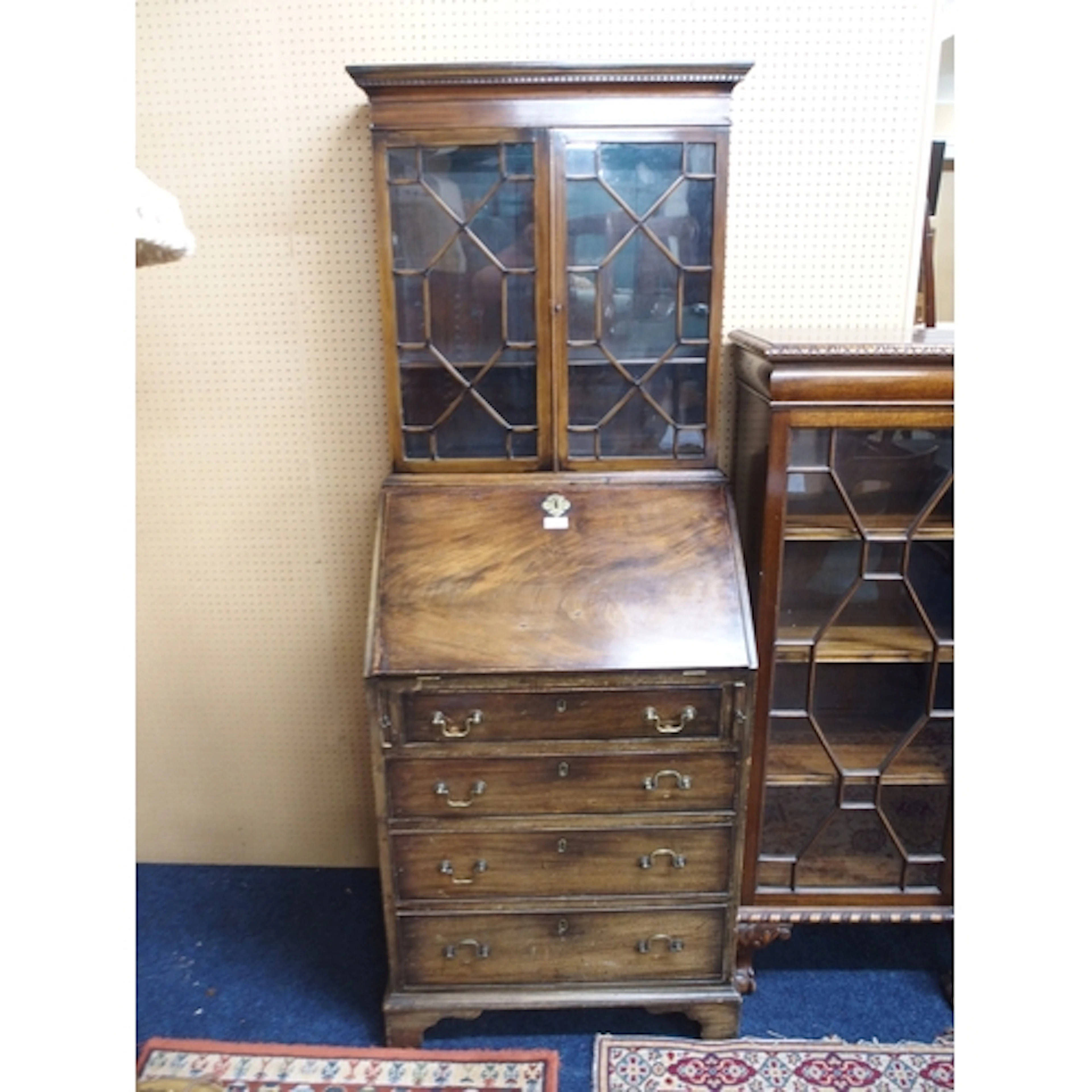A 19th century mahogany bureau bookcase with astragal glazed...
