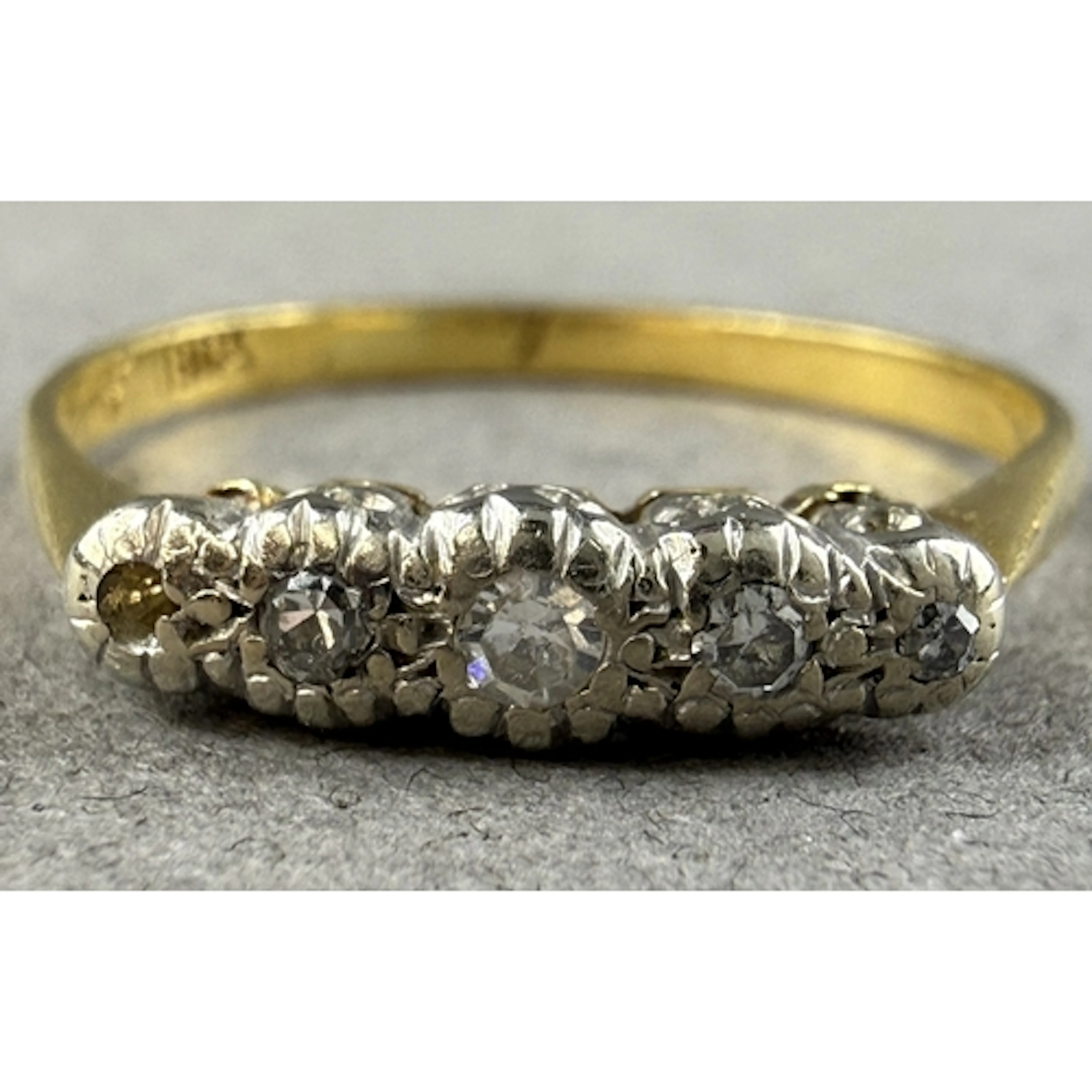 Jewellery: a yellow metal and diamond ring, marked 18ct and ...