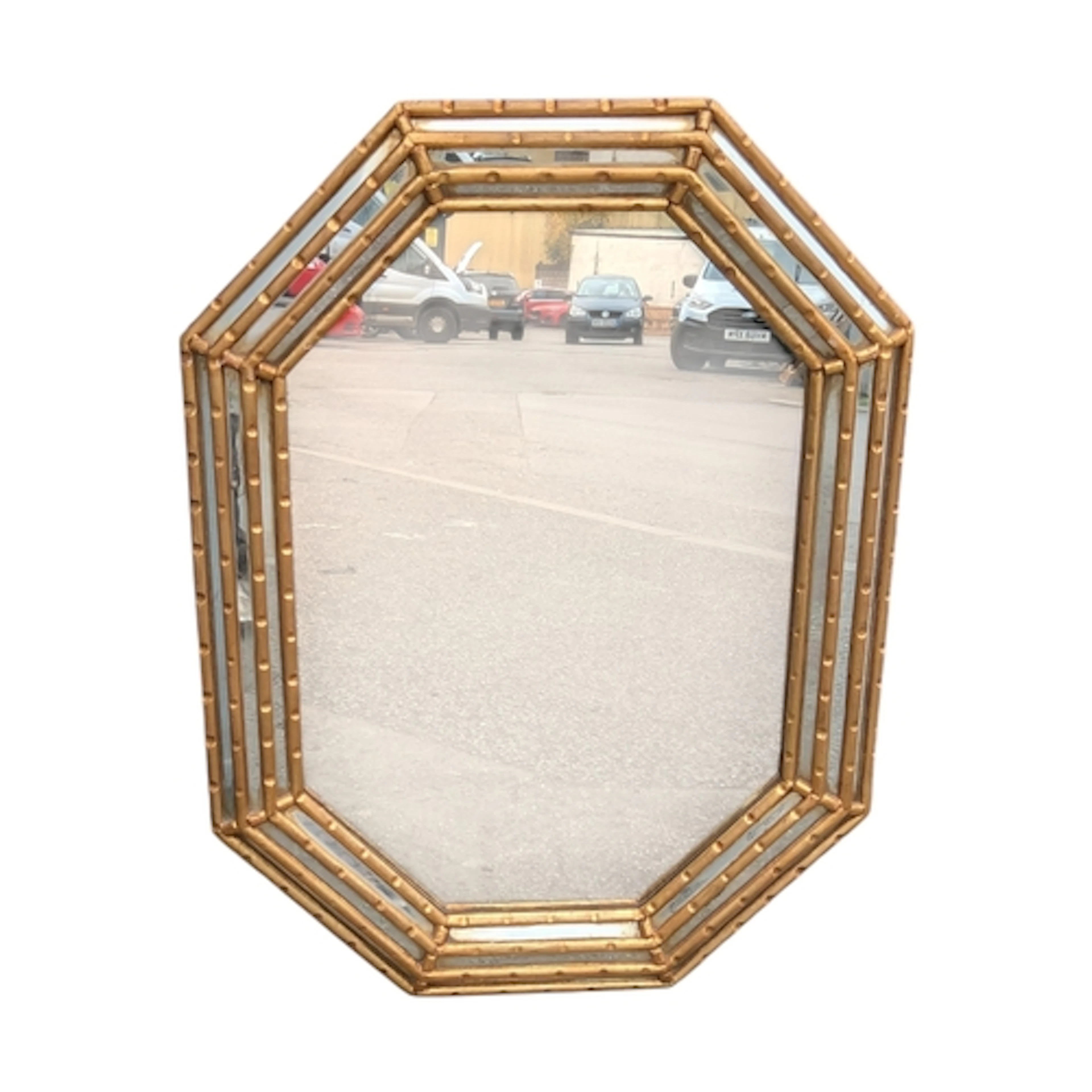 A 20th century Venetian style octagonal elongated wall mirro...