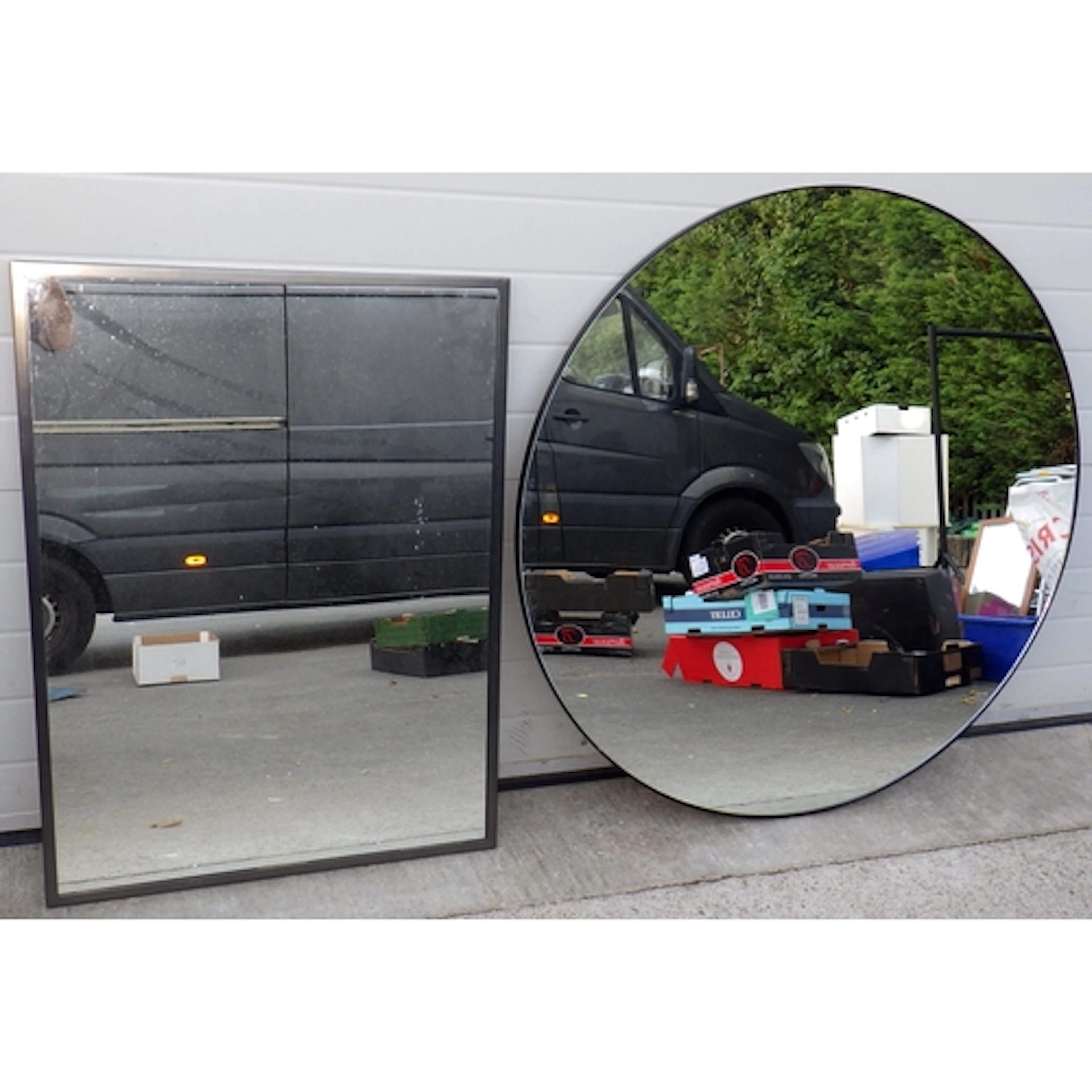A modern circular mirror, 120cm across together with a recta...