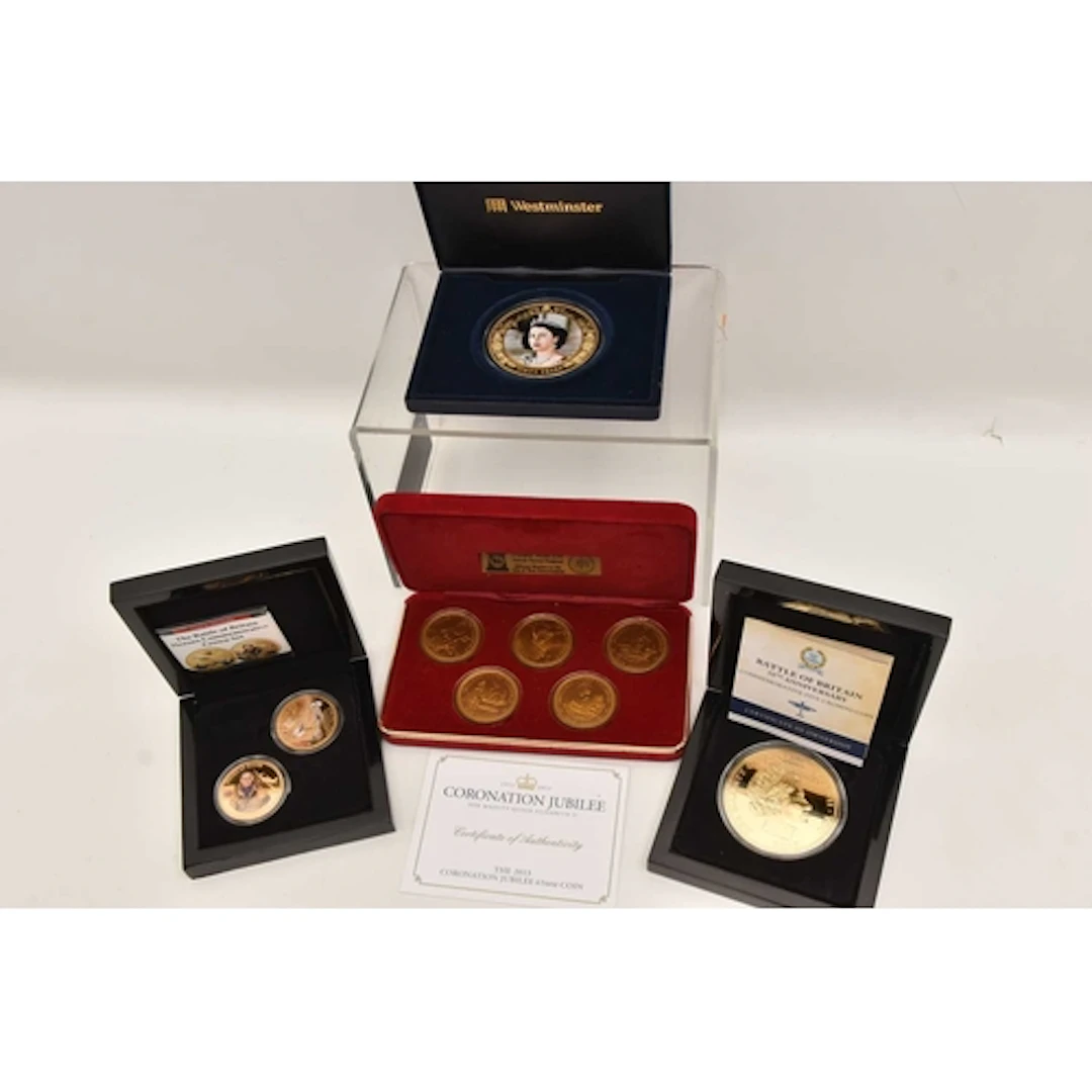 FOUR BOXES OF COINS, to include a cased set of 'Pobjoy Mint ...