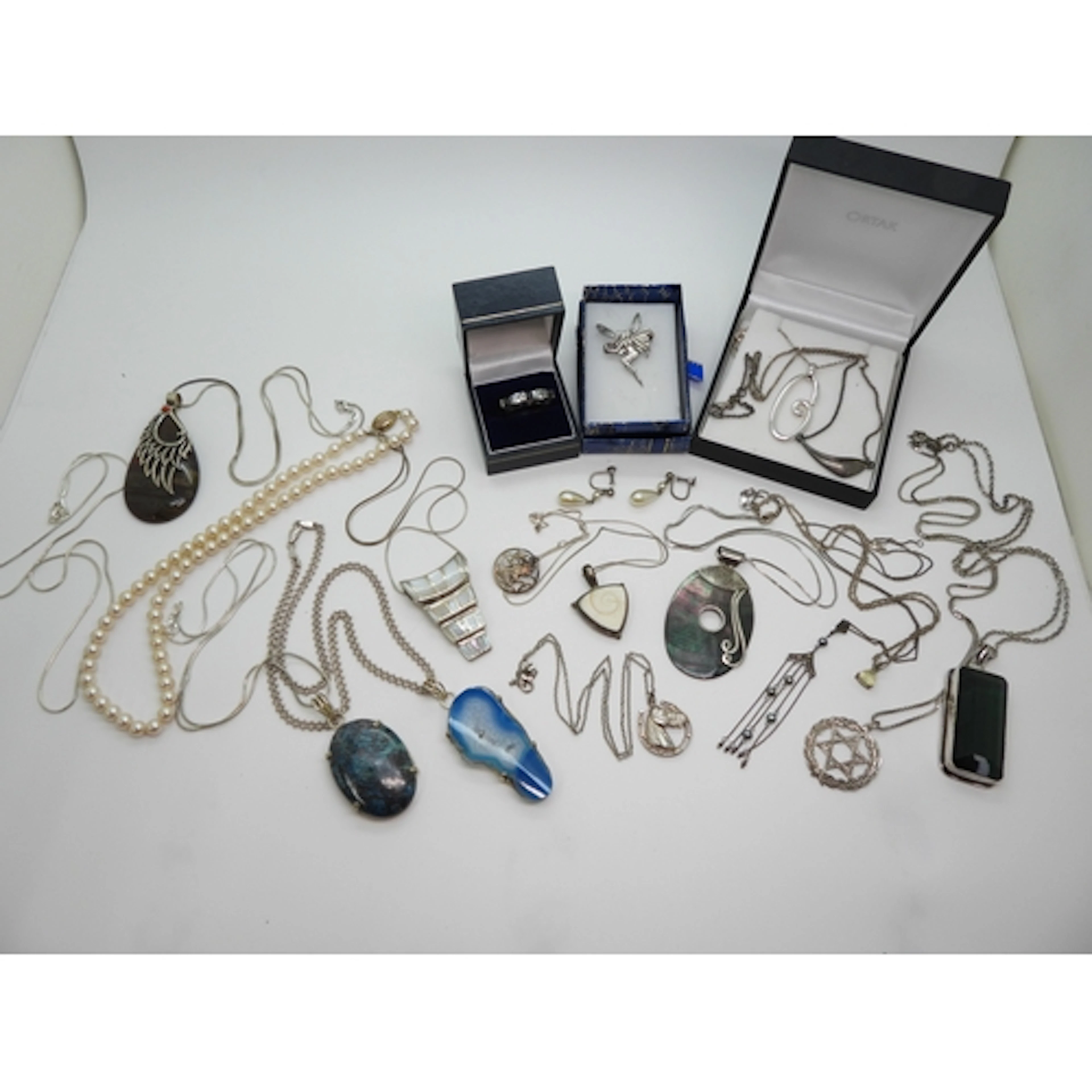A collection of silver and white metal items to include a ho...