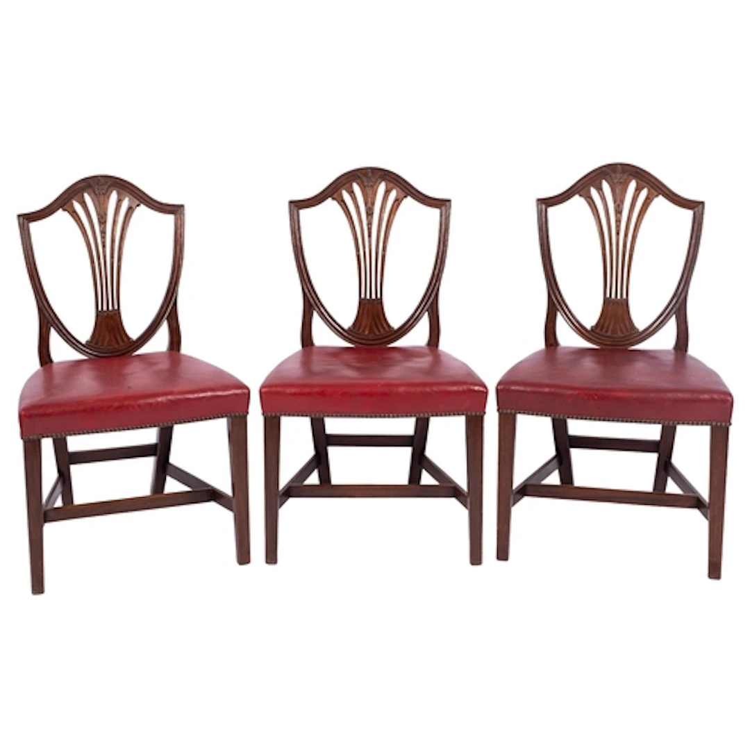 A set of eight mahogany shield-back dining chairs, in George...