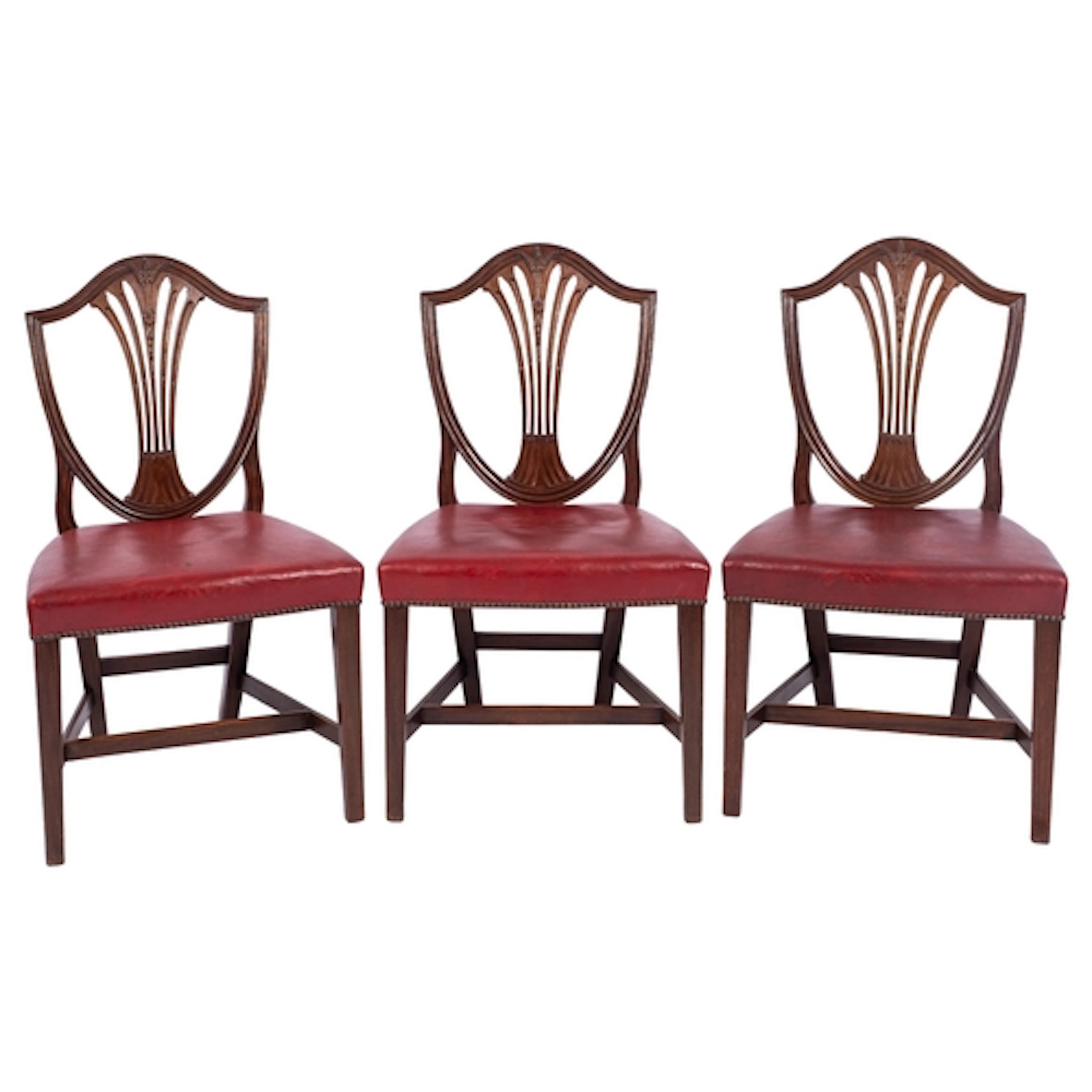 A set of eight mahogany shield-back dining chairs, in George...