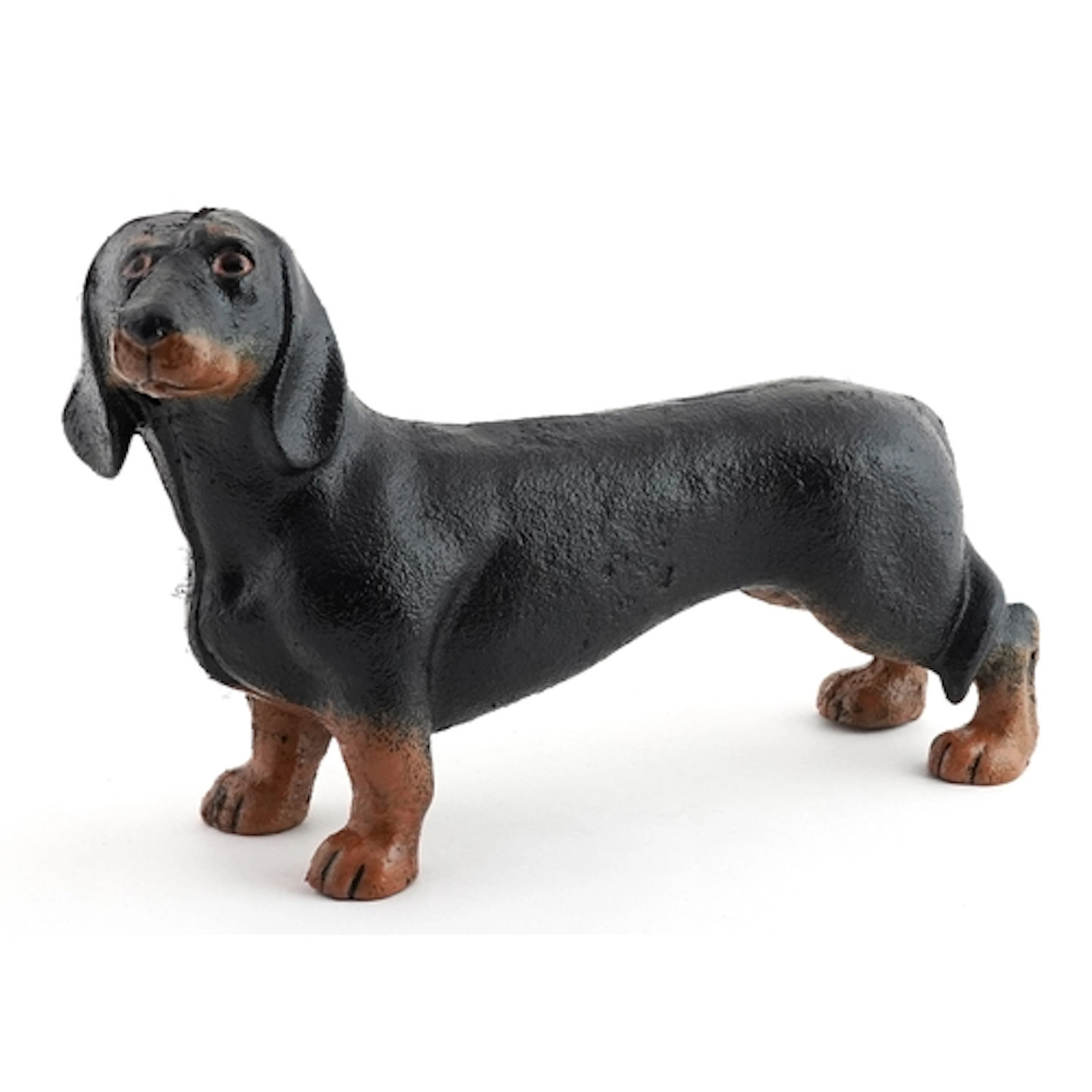 Novelty cast iron figure of a Dachshund, 24cm in length.