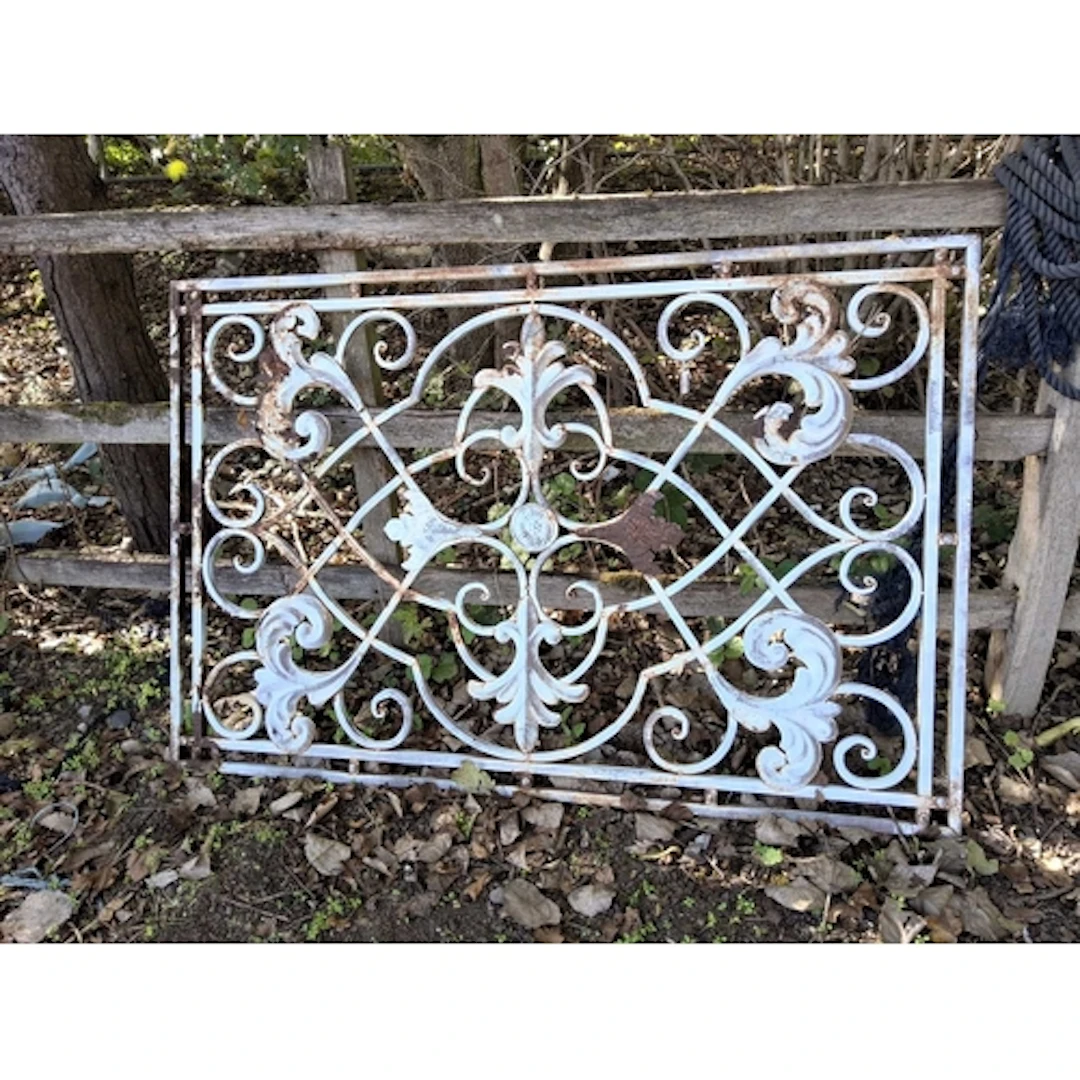 A DECORATIVE METAL PANEL with scrolled and foliate detail 15...