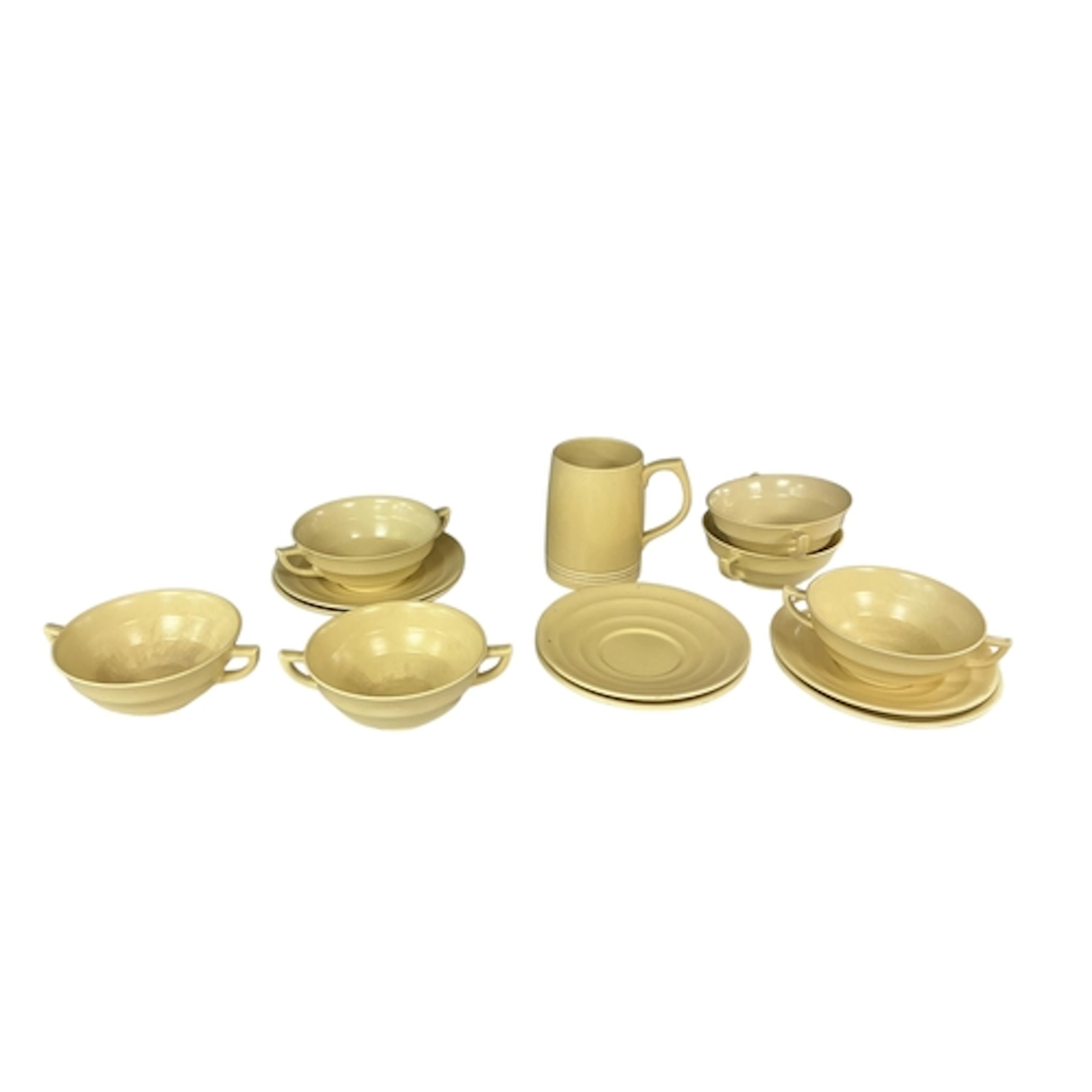 Six Keith Murray straw yellow soup bowls and saucers and a s...