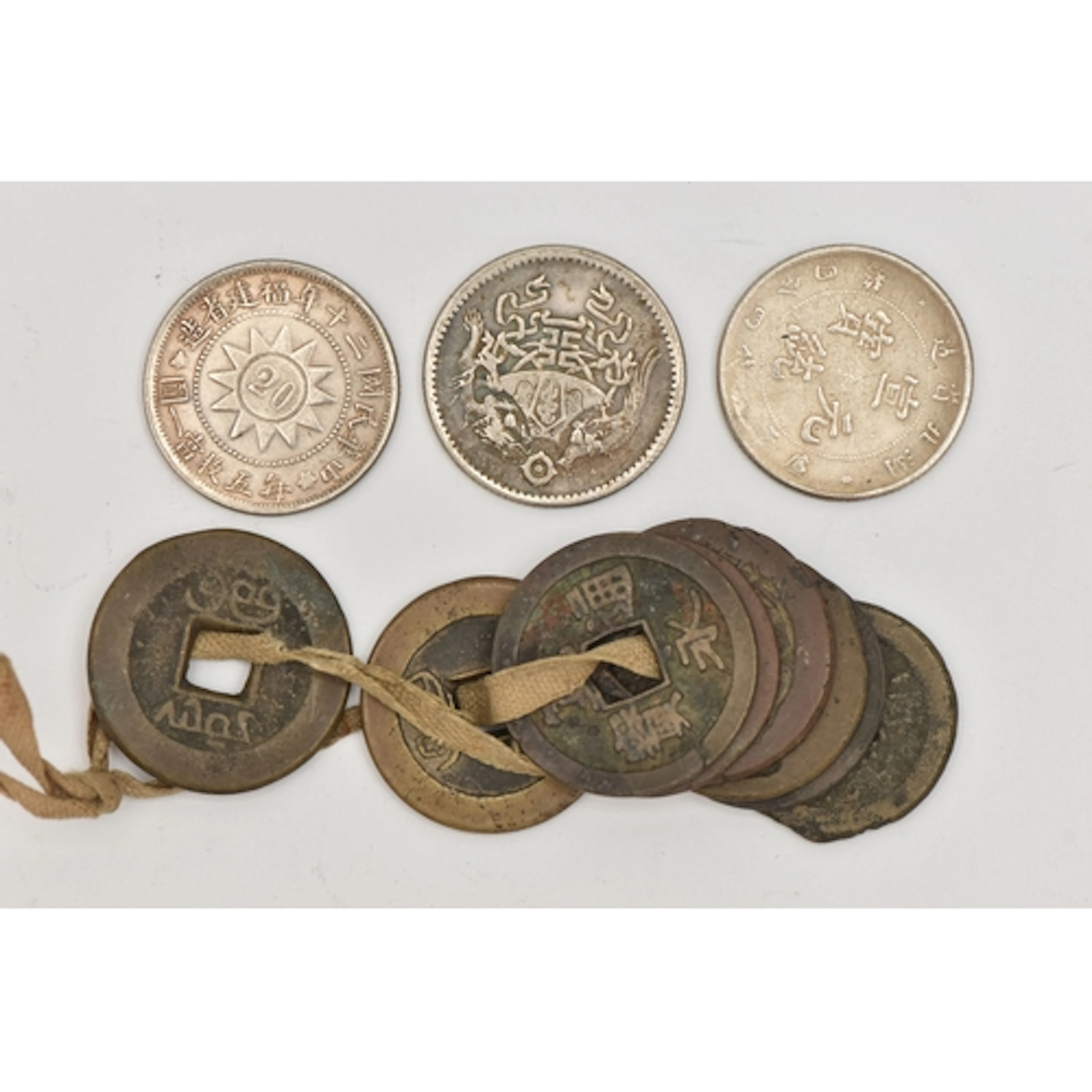 A PACKET CONTAINING ASIAN COINS TO INCLUDE A Republic of Chi...